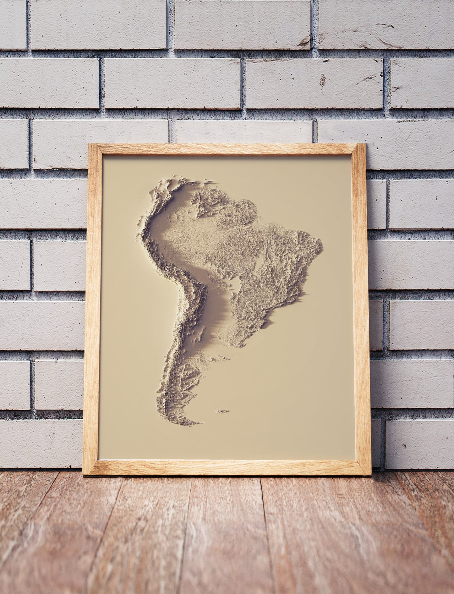 South America shaded relief map in black frame. Artistic print with realistic terrain effect for wall decor