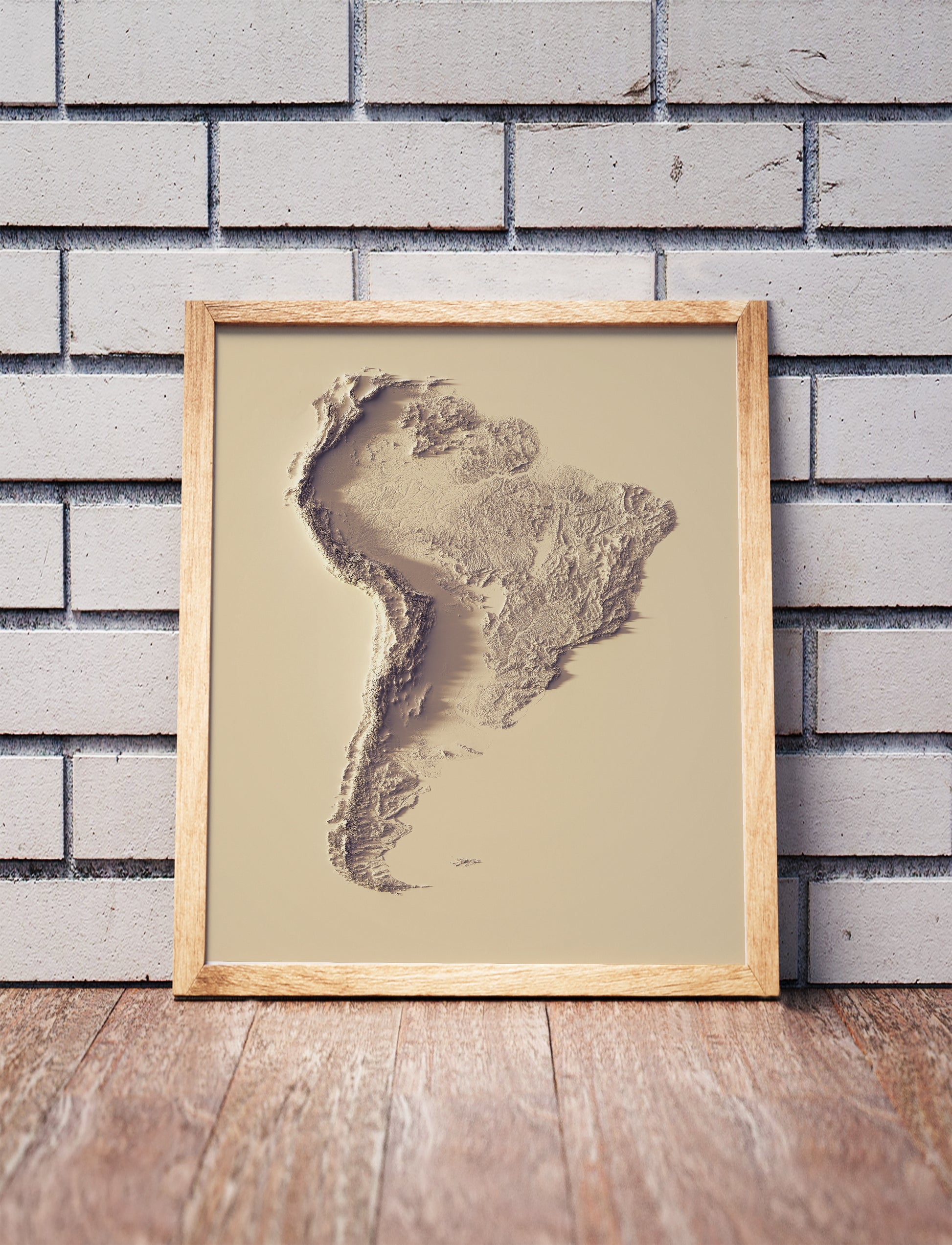 South America shaded relief map in black frame. Artistic print with realistic terrain effect for wall decor
