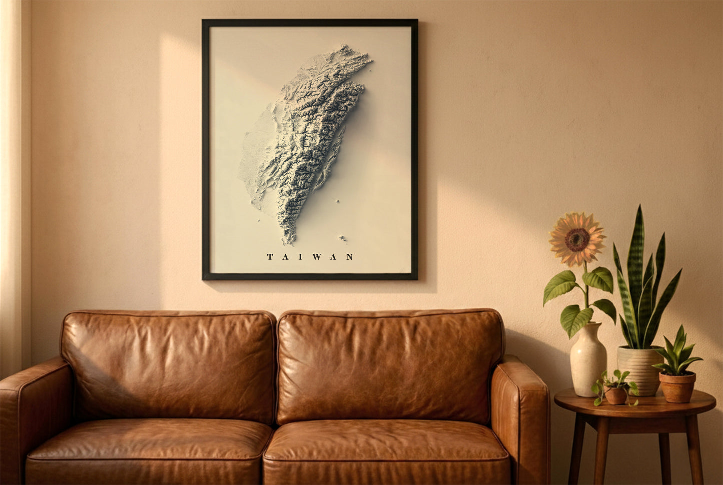 Taiwan relief map in a black frame above a brown leather sofa. Boho living room with warm sunlight, sunflower, and indoor plants on a wooden side table