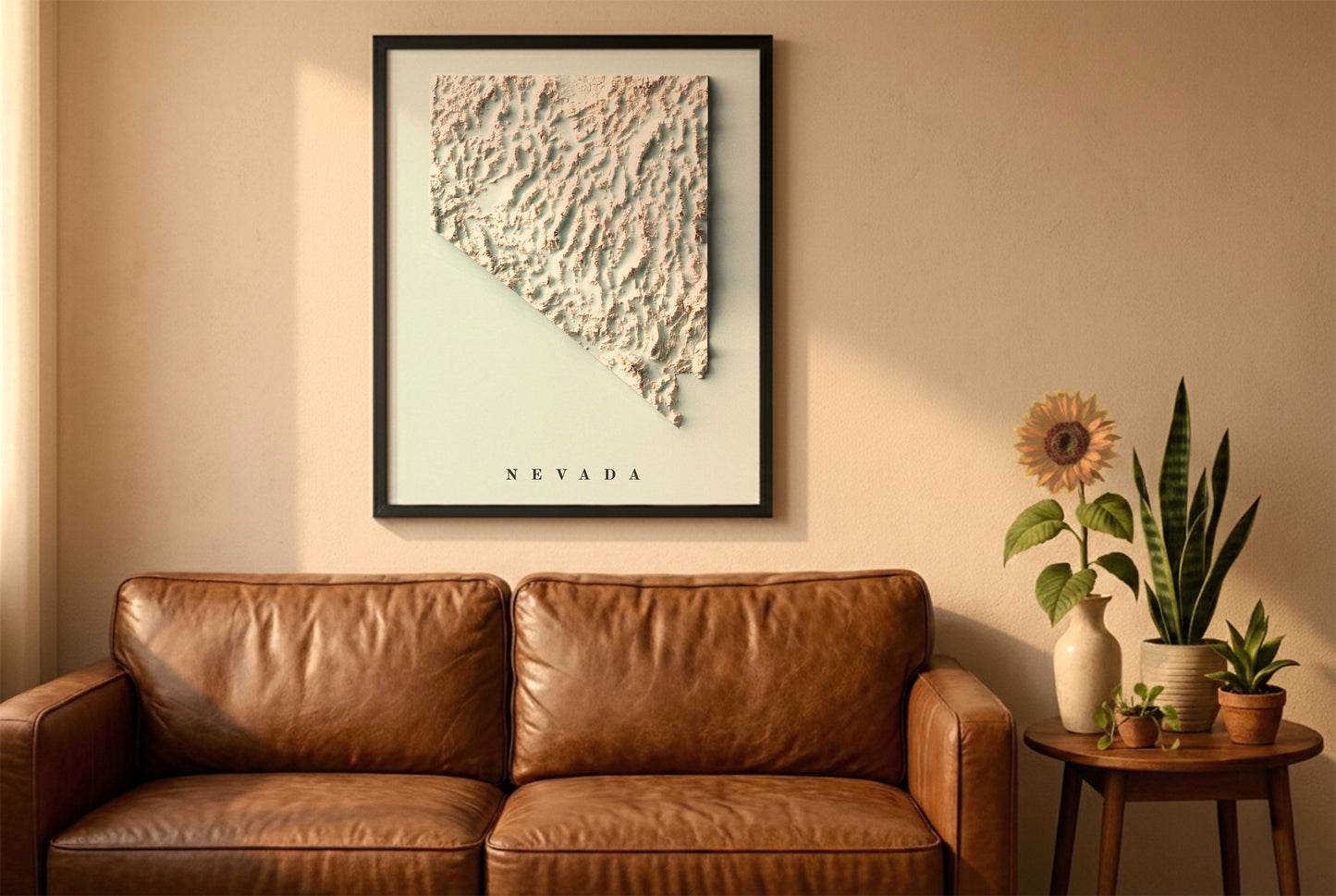 Nevada relief map in a black frame above a brown leather sofa. Boho living room with warm sunlight, sunflower, and indoor plants on a wooden side table