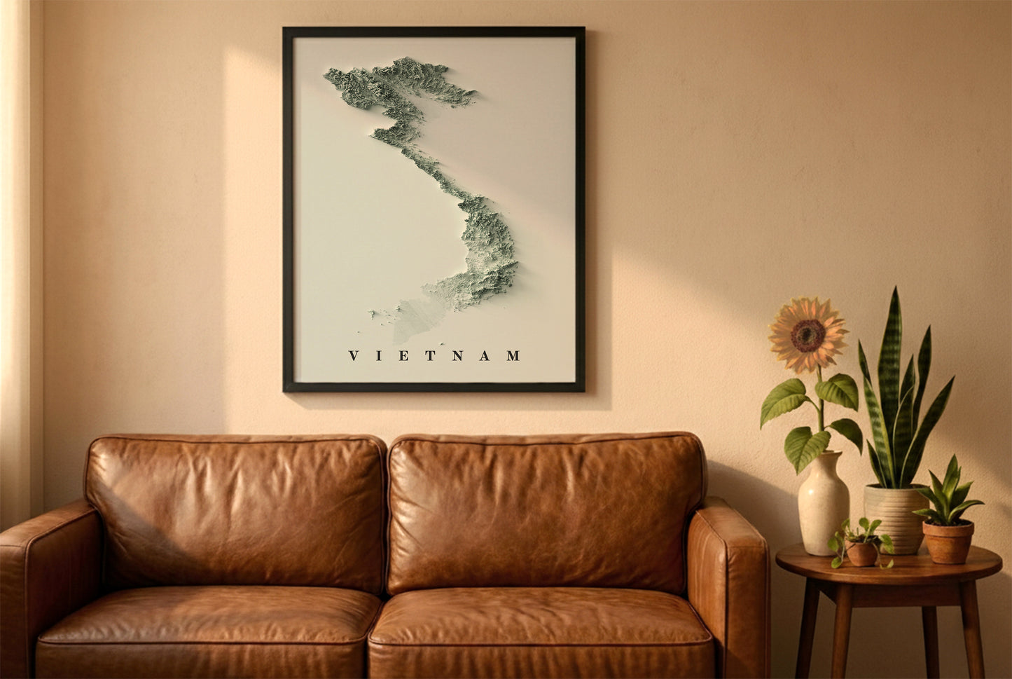 Vietnam shaded relief map in a wooden frame. Realistic terrain art print for home decor, displayed against a brick wall