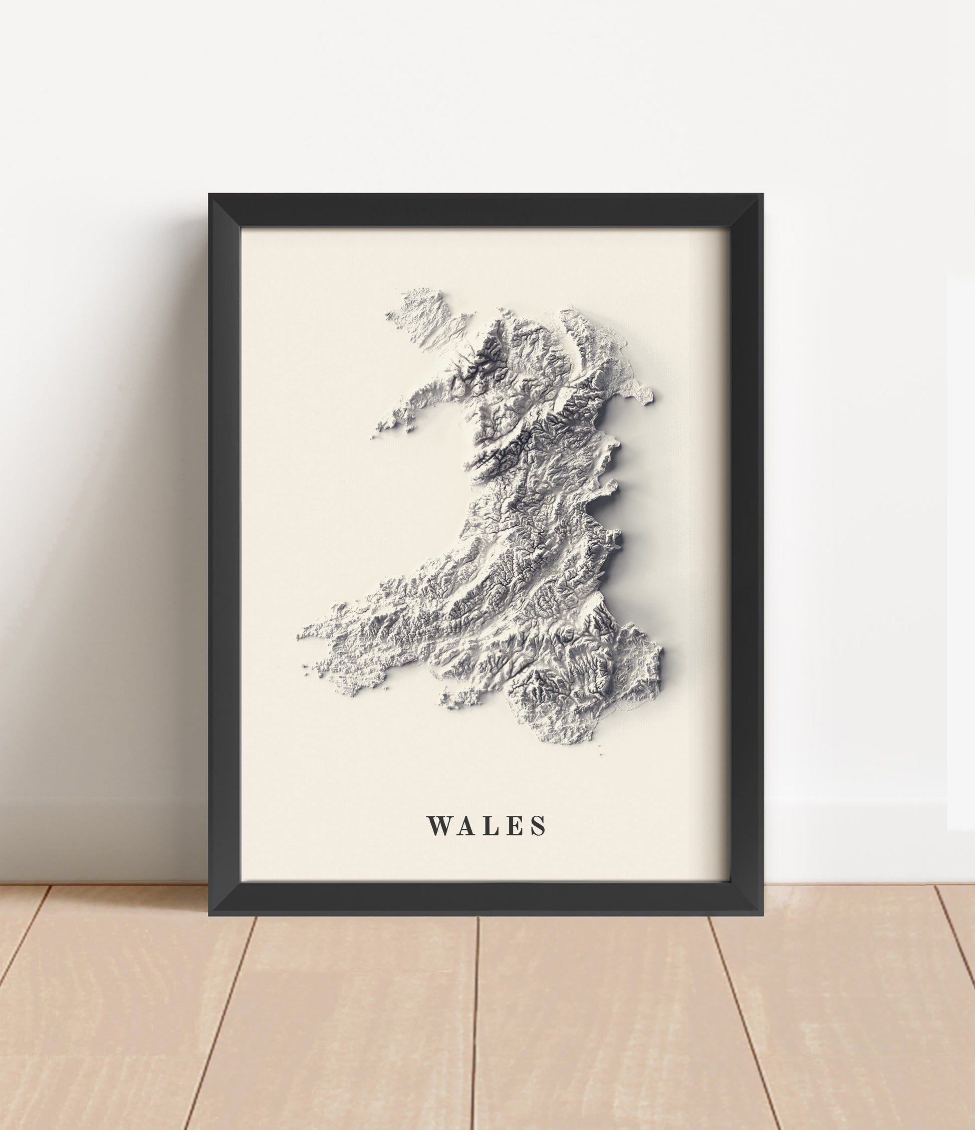 wales shaded relief map in black frame. Artistic print with realistic terrain effect for wall decor