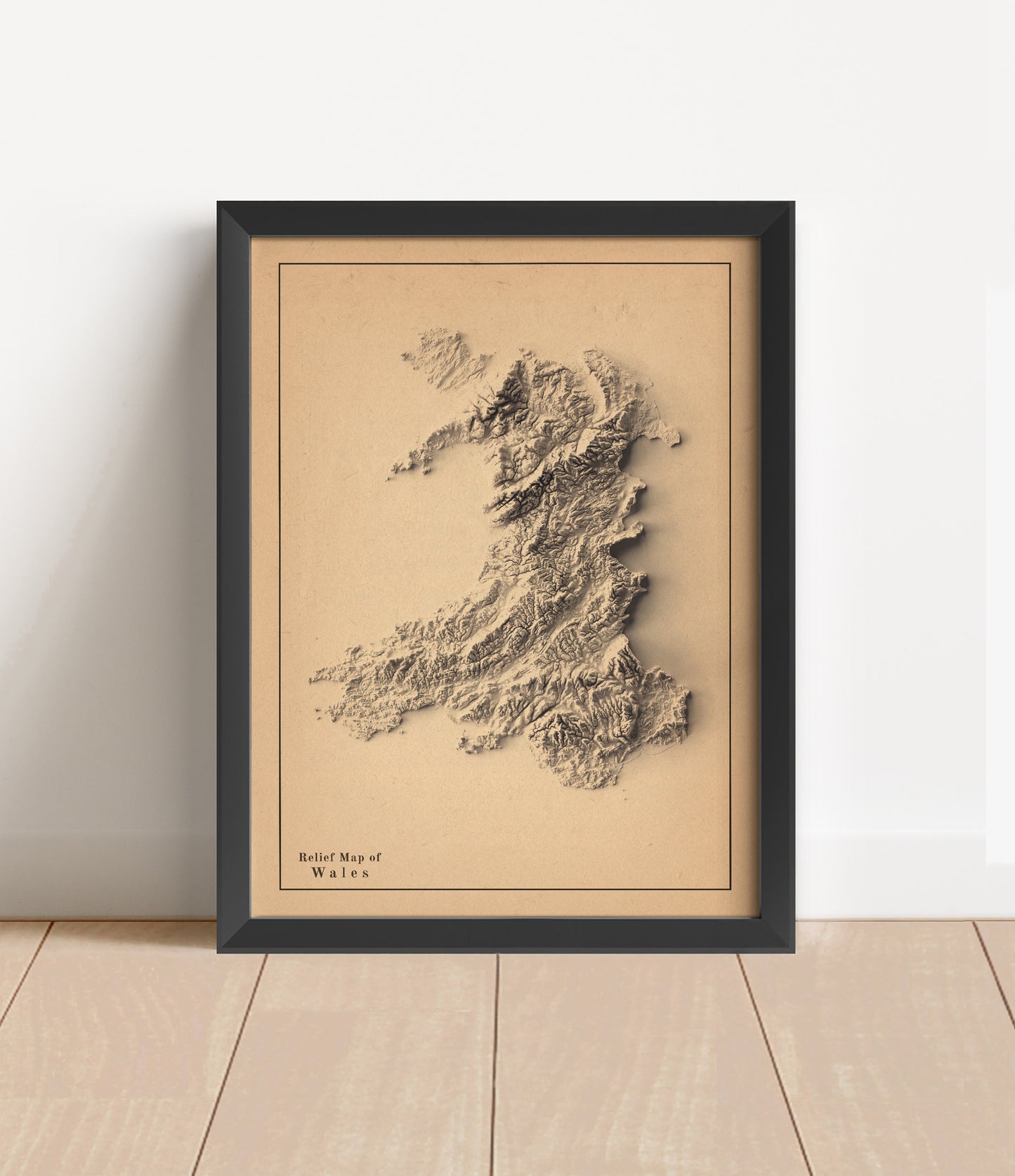 wales shaded relief map in black frame. Artistic print with realistic terrain effect for wall decor