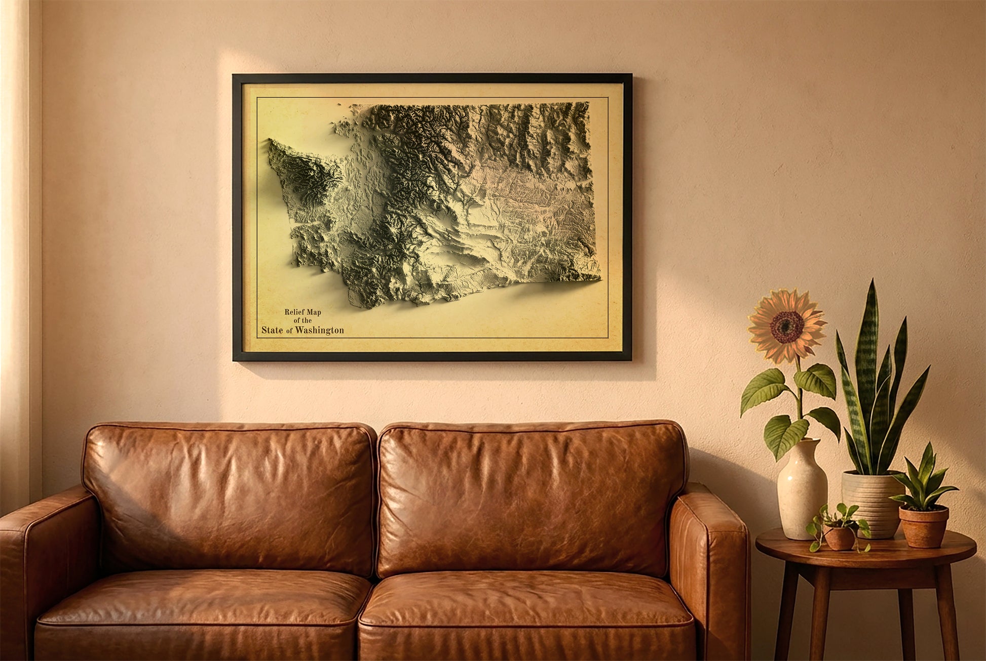 Washington vintage relief map in a black frame above a brown leather sofa. Boho living room with warm sunlight, sunflower, and indoor plants on a wooden side table