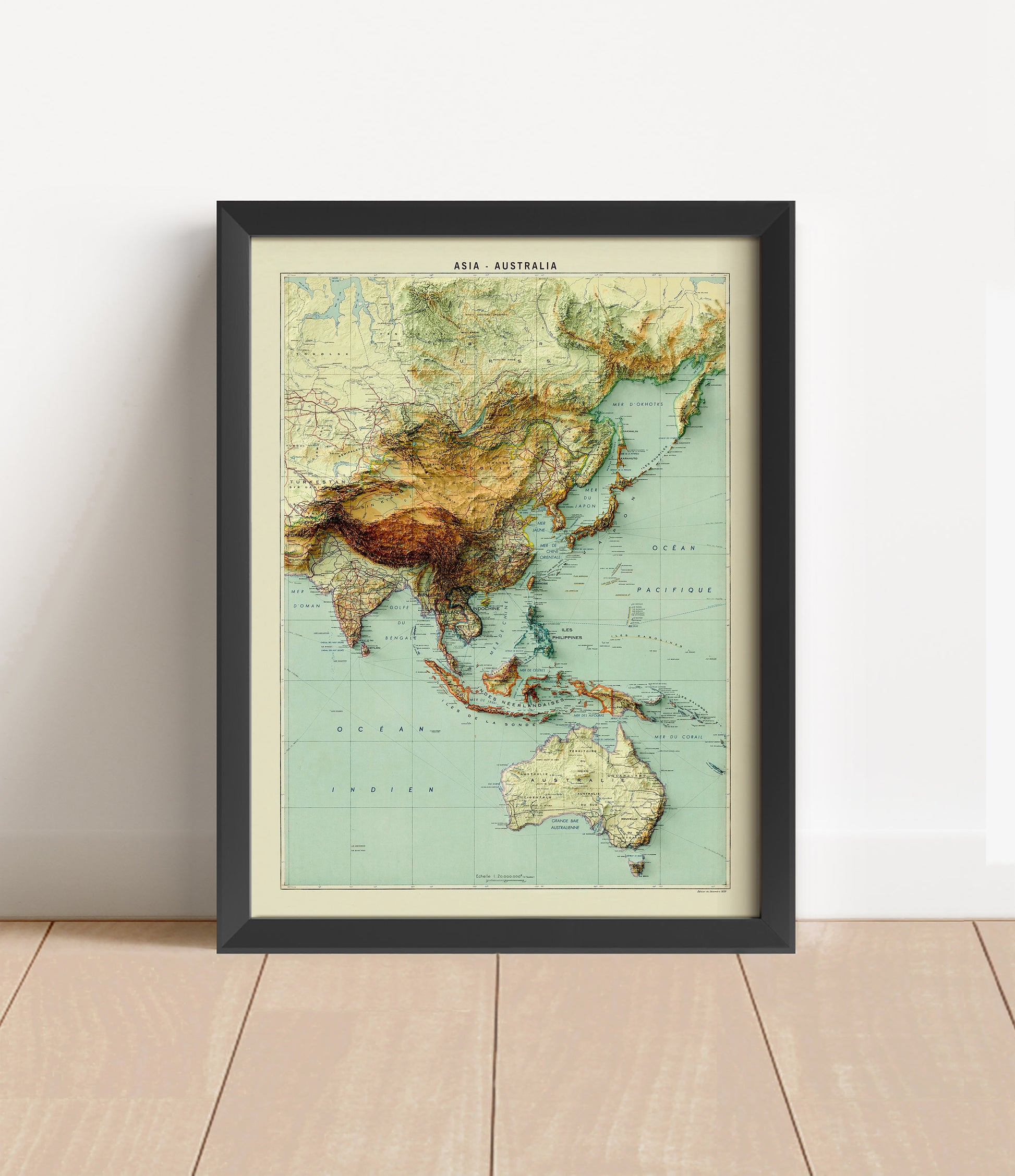 Vintage Asia and Australia shaded relief map in black frame. Artistic print with realistic terrain effect for wall decor