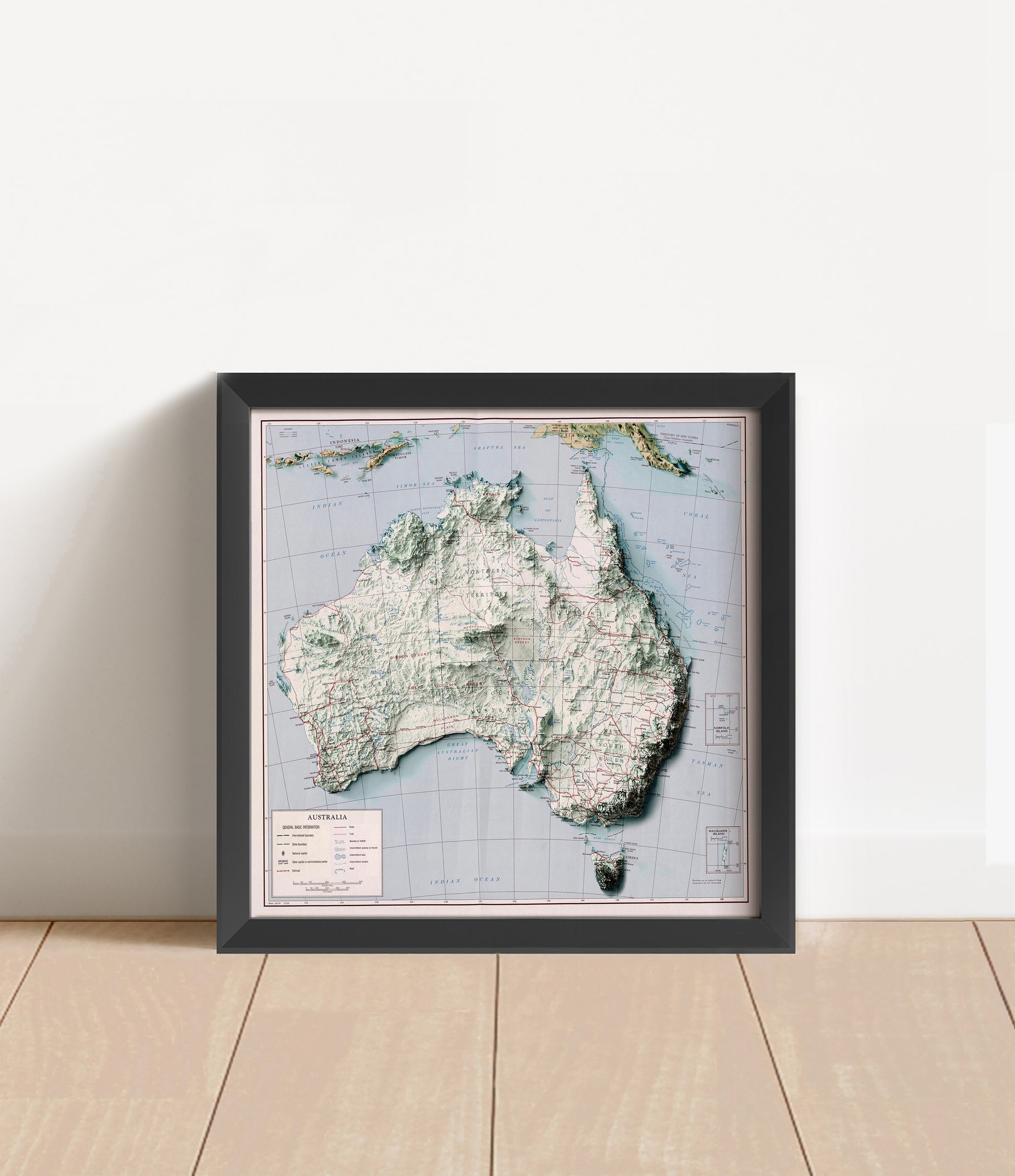 Vintage Australia shaded relief map in black frame. Artistic print with realistic terrain effect for wall decor