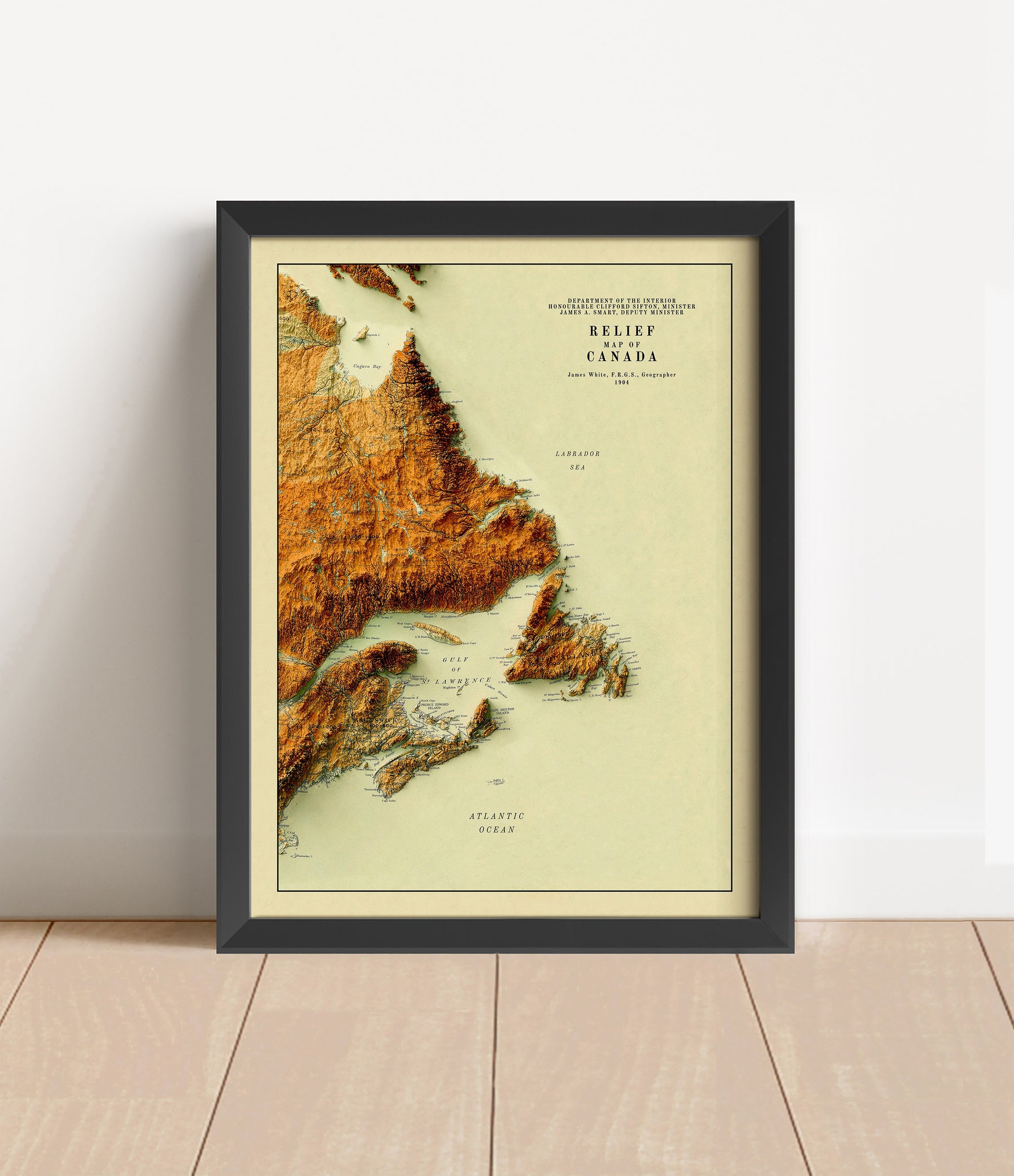 Vintage Atlantic Canada shaded relief map in black frame. Artistic print with realistic terrain effect for wall decor