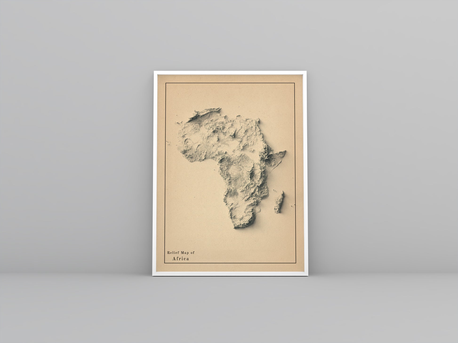 Africa framed shaded relief map in white frame. Artistic print highlighting mountains with a realistic 3d effect