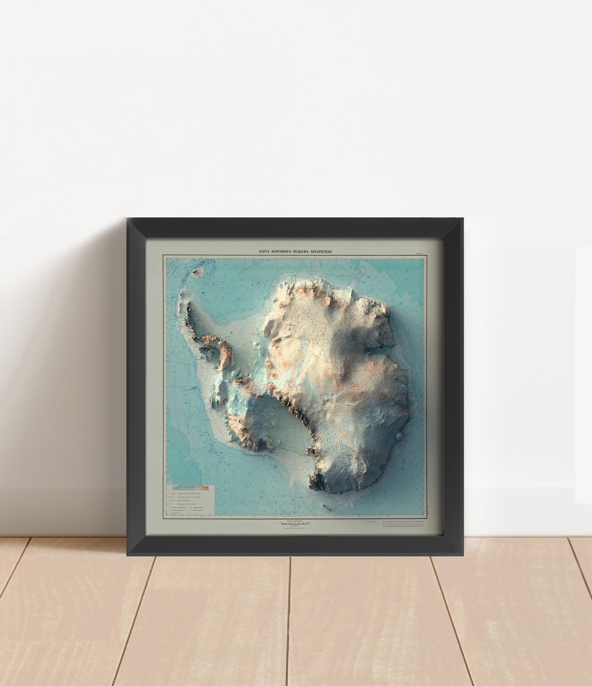 Vintage Antarctica shaded relief map in black frame. Artistic print with realistic terrain effect for wall decor
