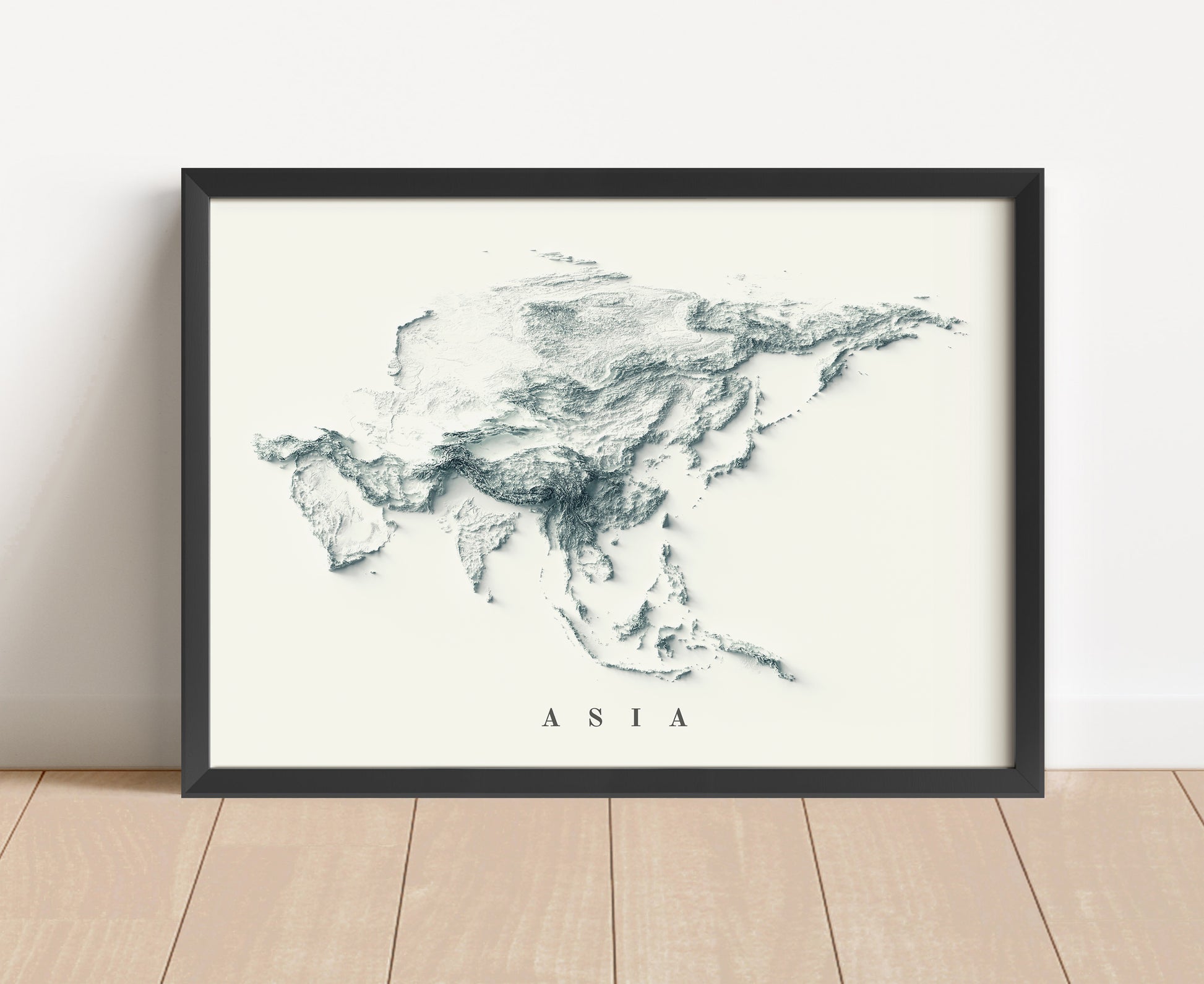 Asia shaded relief map in black frame. Artistic print with realistic terrain effect for wall decor