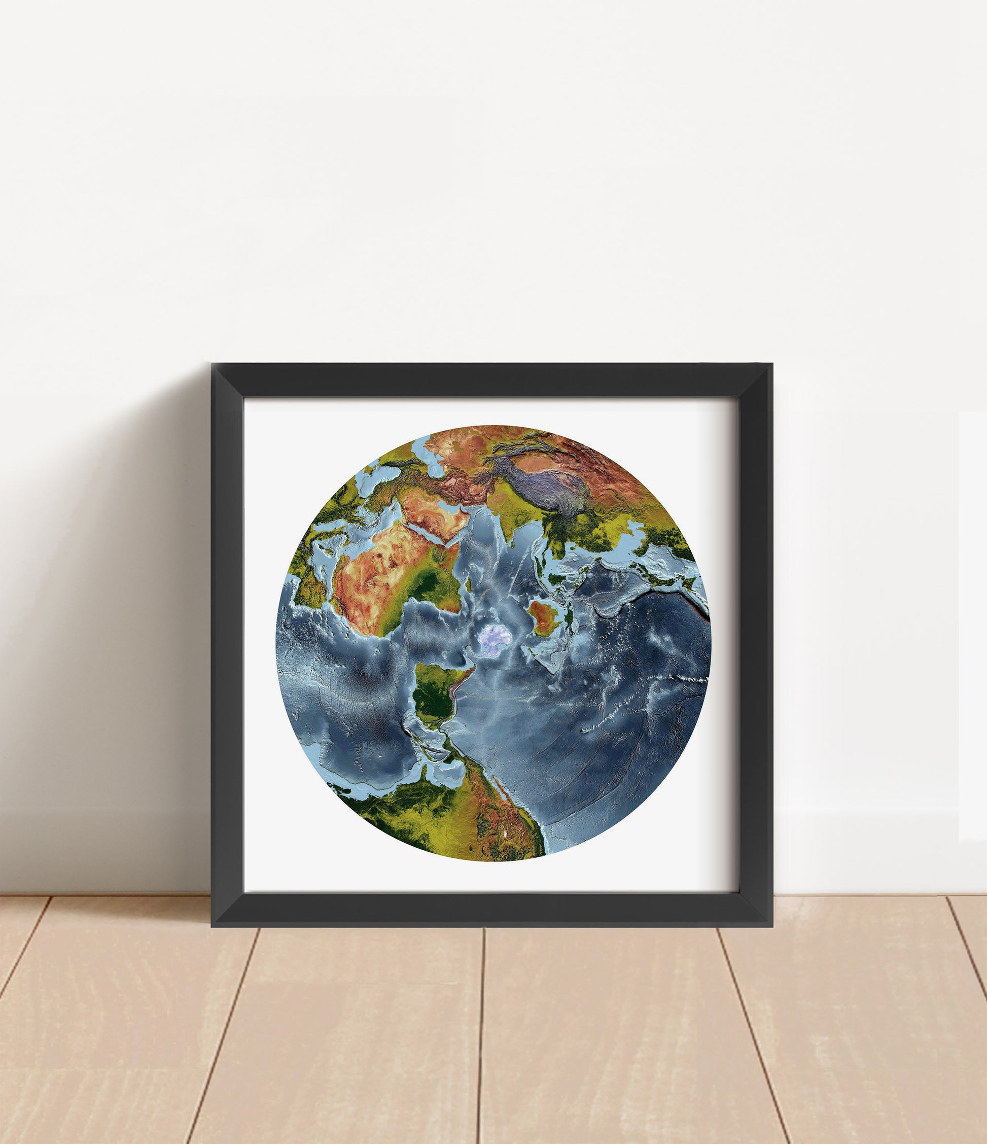 Shaded relief world map in Australian Antarctic Polar projection in black frame. Artistic print with realistic terrain effect for wall decor