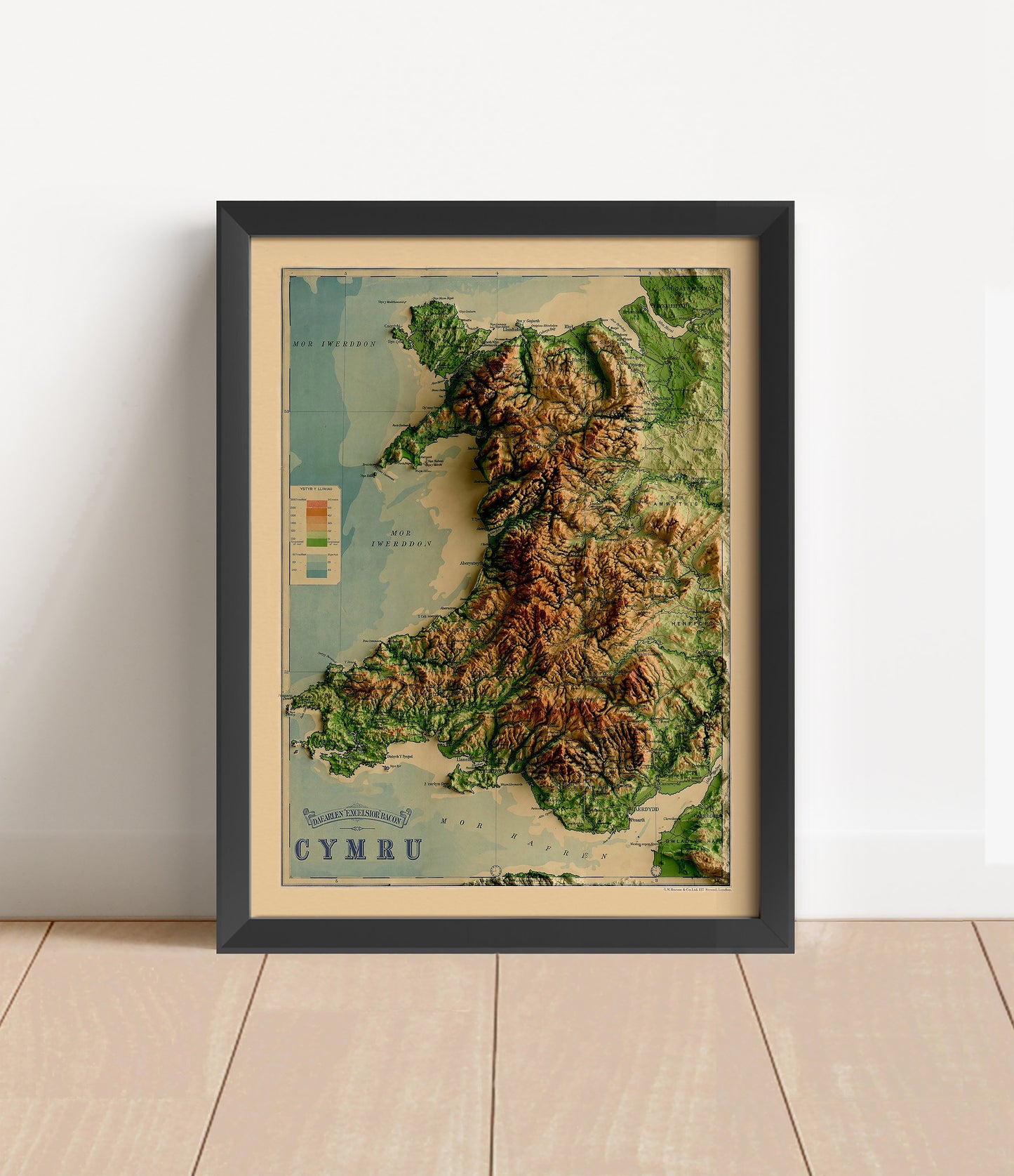 Vintage Wales shaded relief map in black frame. Artistic print with realistic terrain effect for wall decor