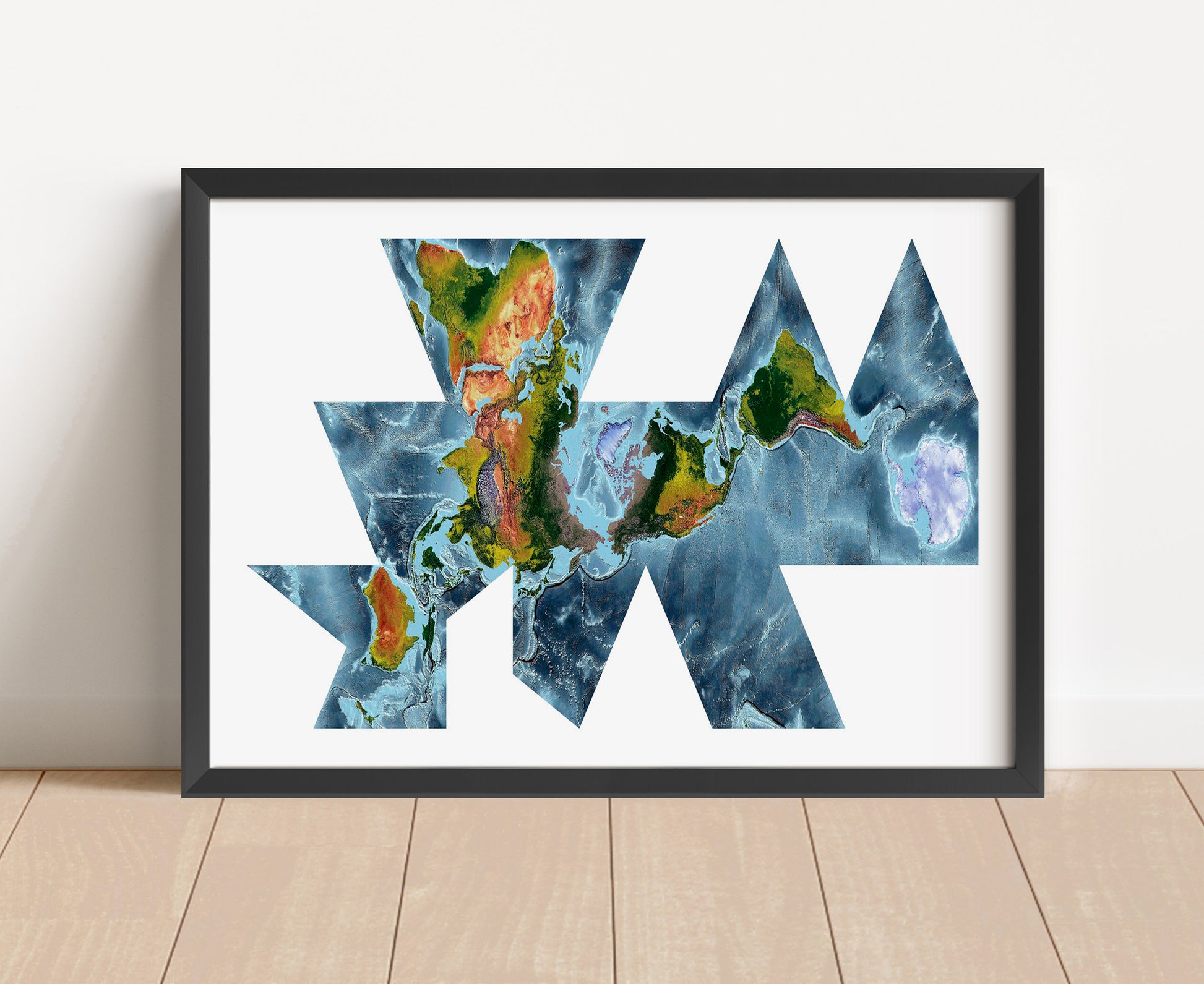 Shaded relief world map in Fuller projection in black frame. Artistic print with realistic terrain effect for wall decor