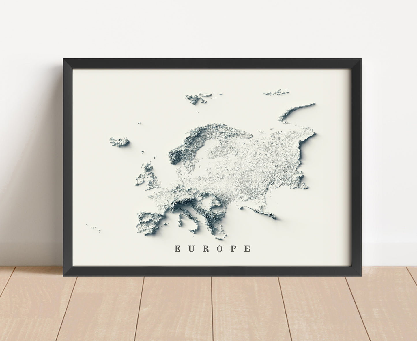 Europe shaded relief map in black frame. Artistic print with realistic terrain effect for wall decor