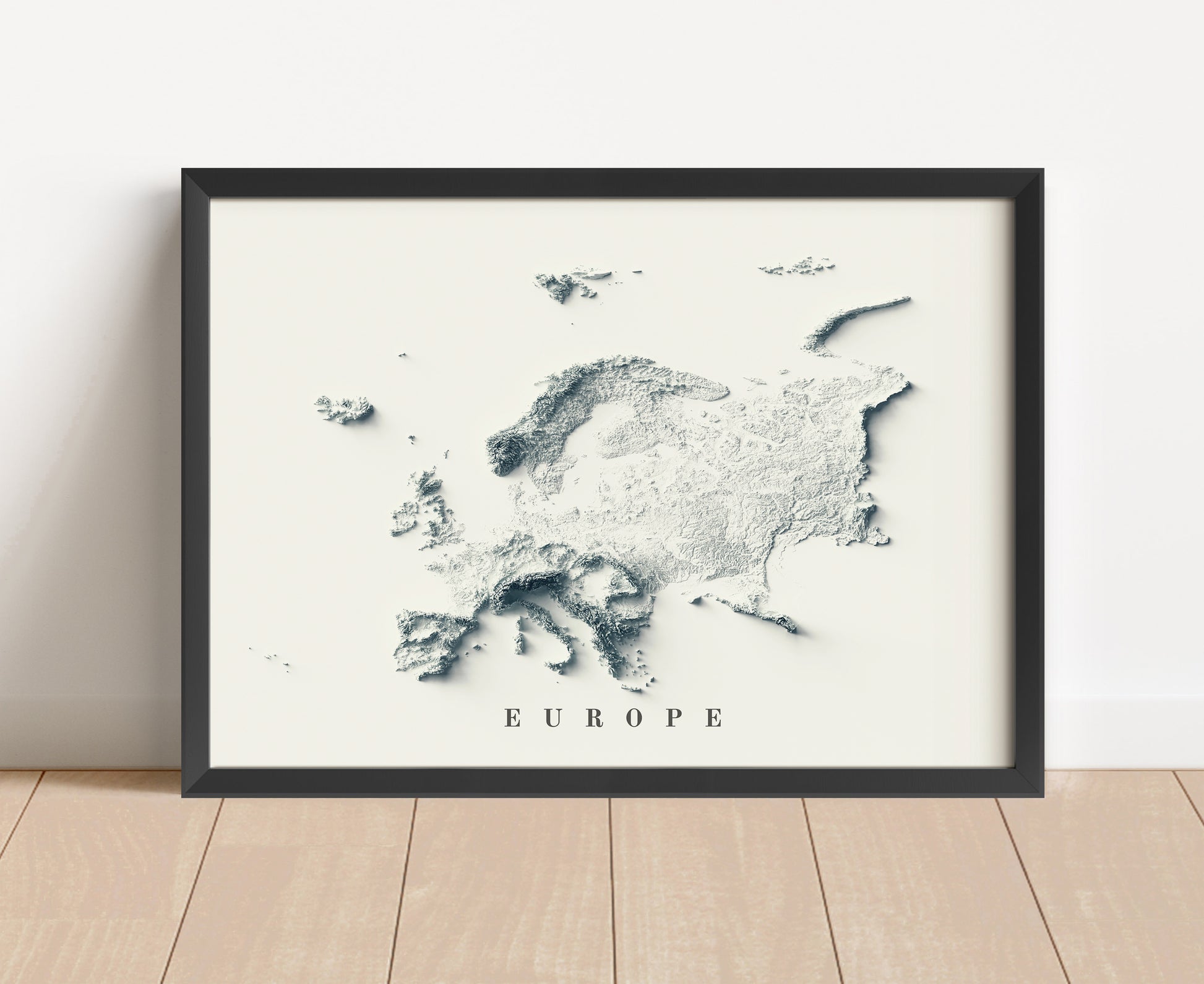 Europe shaded relief map in black frame. Artistic print with realistic terrain effect for wall decor