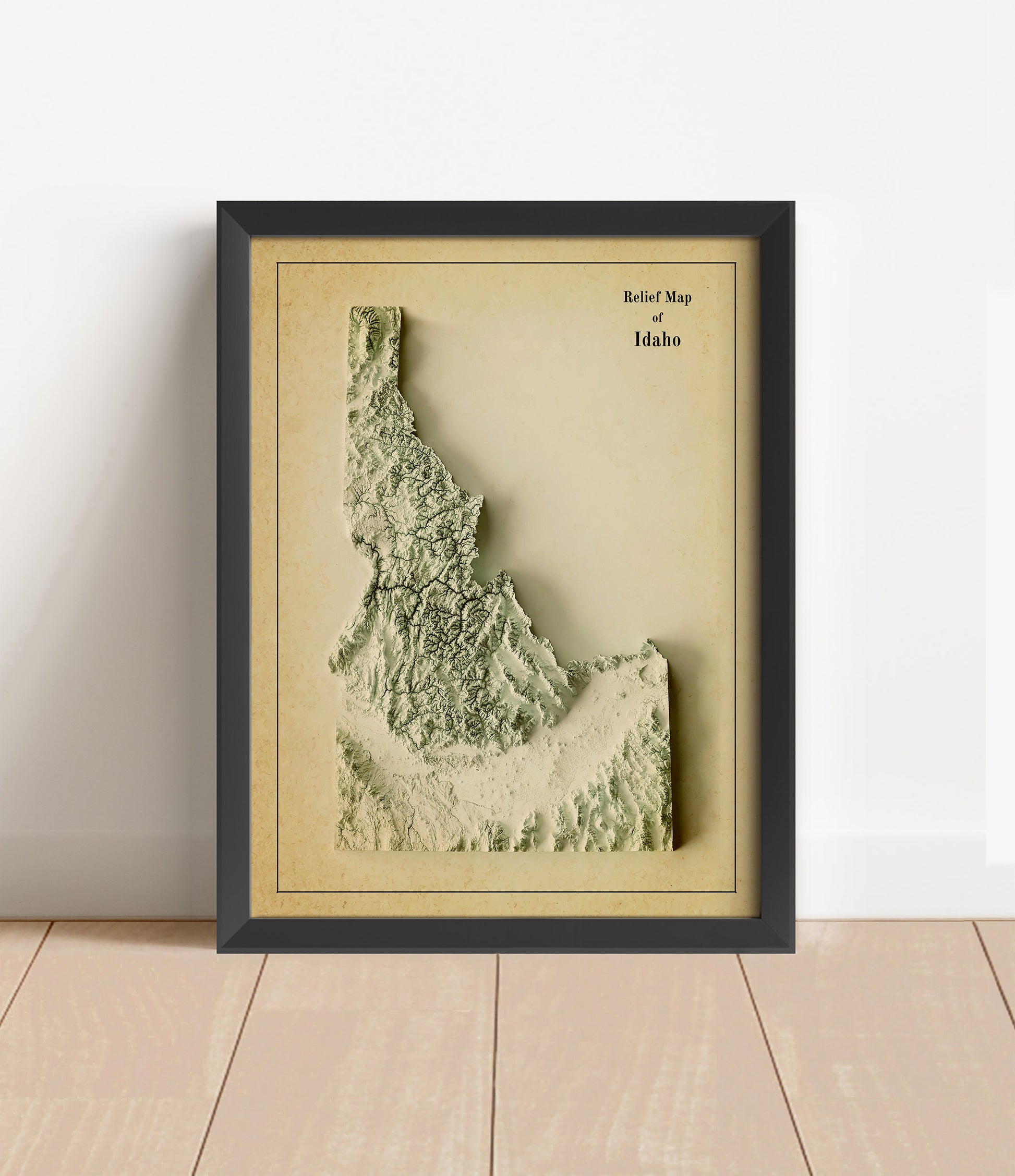 Vintage Idaho shaded relief map in black frame. Artistic print with realistic terrain effect for wall decor