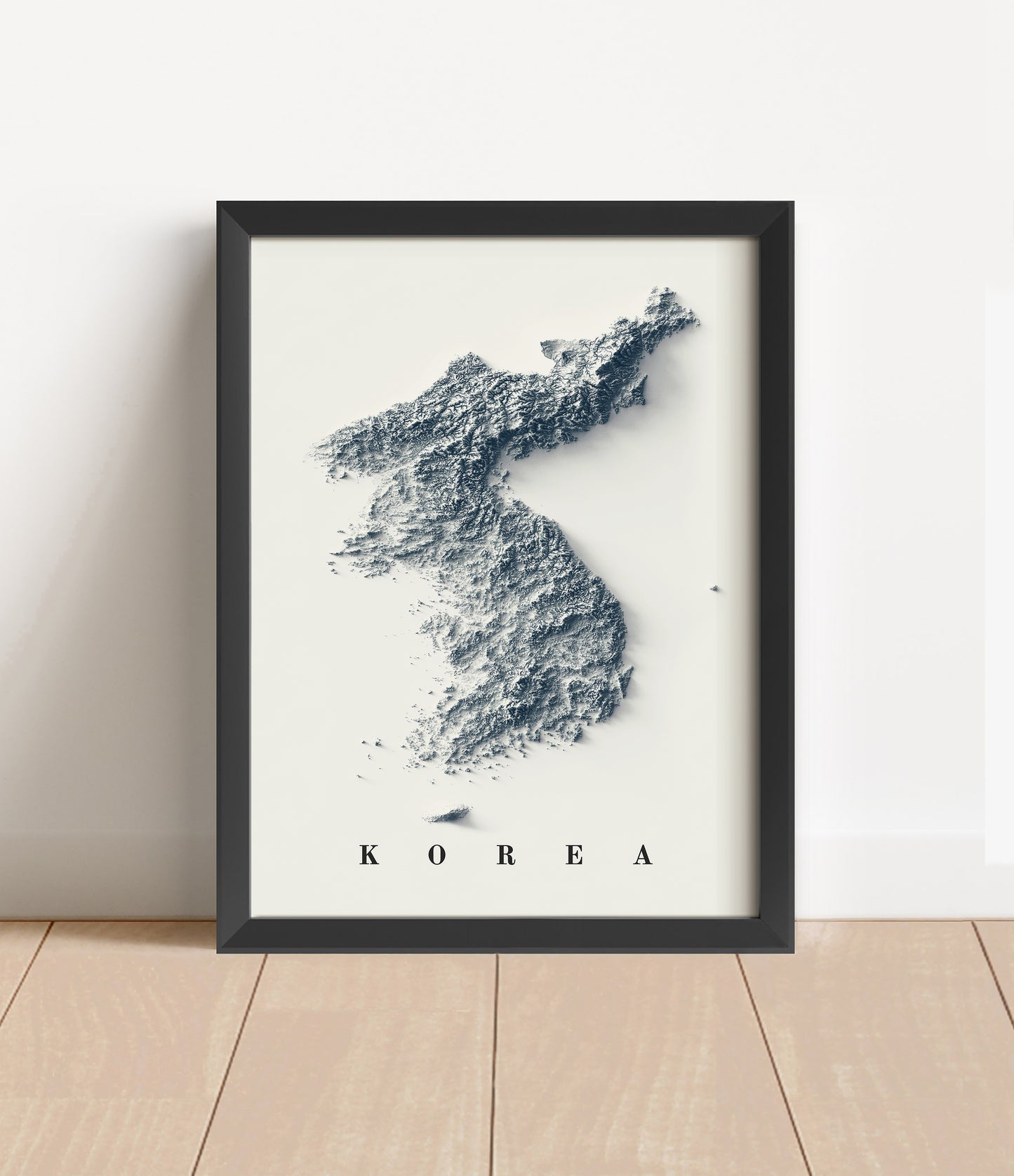 North and South Koreas shaded relief map in black frame. Artistic print with realistic terrain effect for wall decor