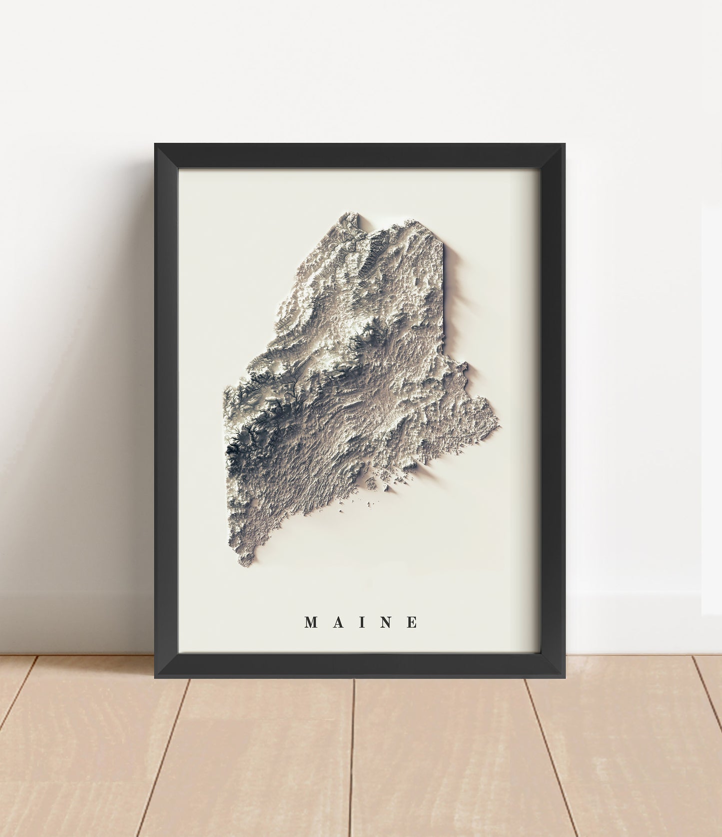 Maine shaded relief map in black frame. Artistic print with realistic terrain effect for wall decor
