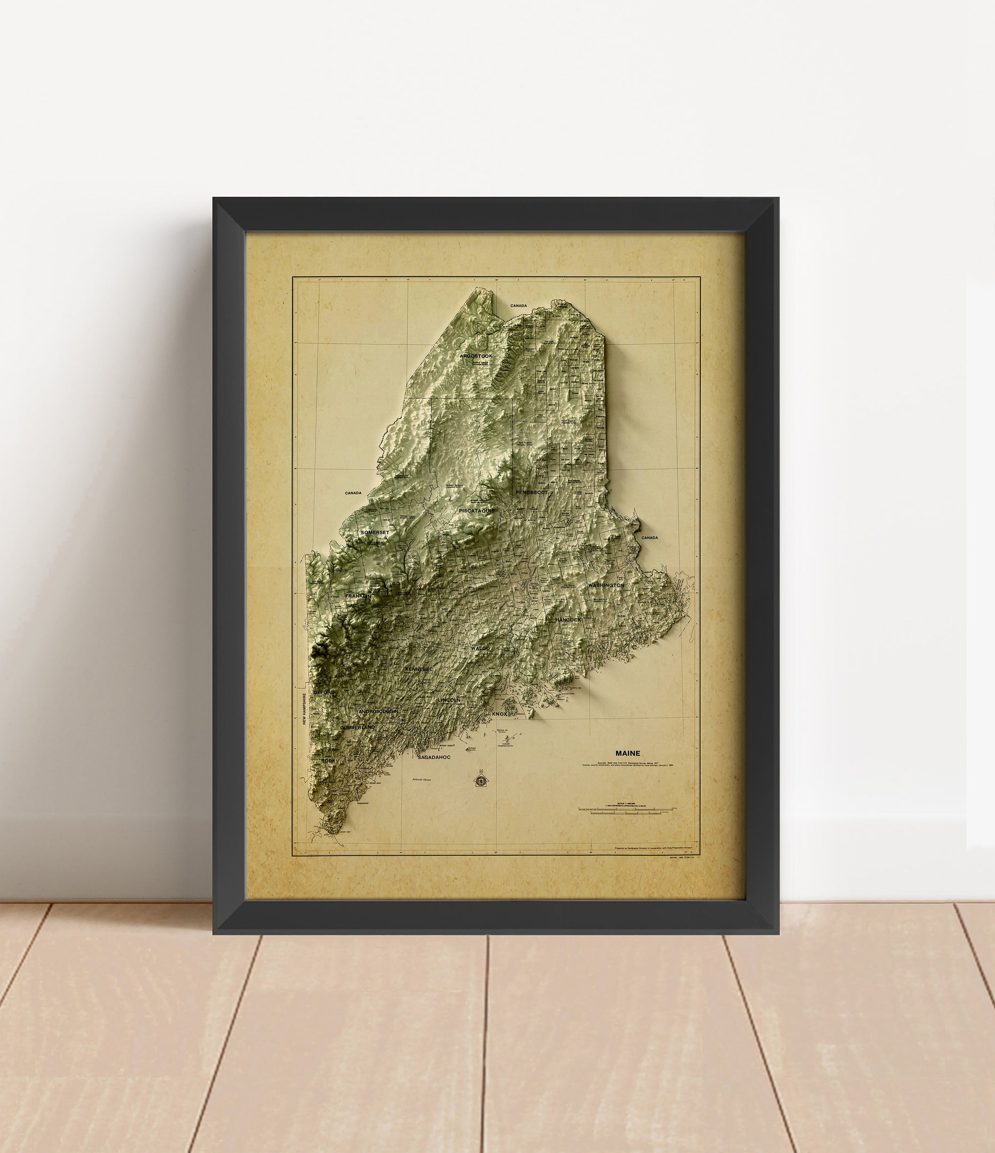 Vintage Maine shaded relief map in black frame. Artistic print with realistic terrain effect for wall decor