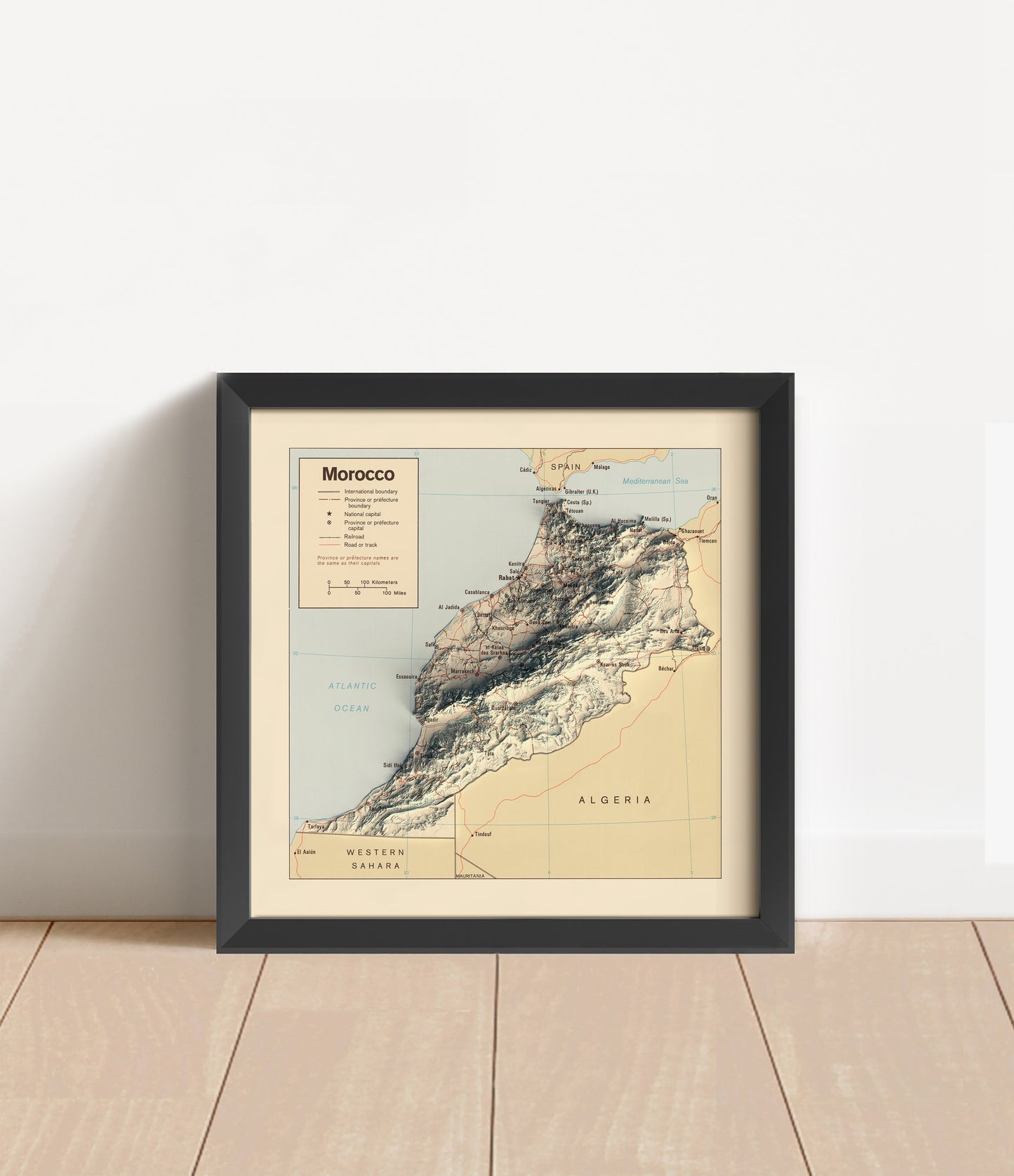 Vintage Morocco shaded relief map in black frame. Artistic print with realistic terrain effect for wall decor
