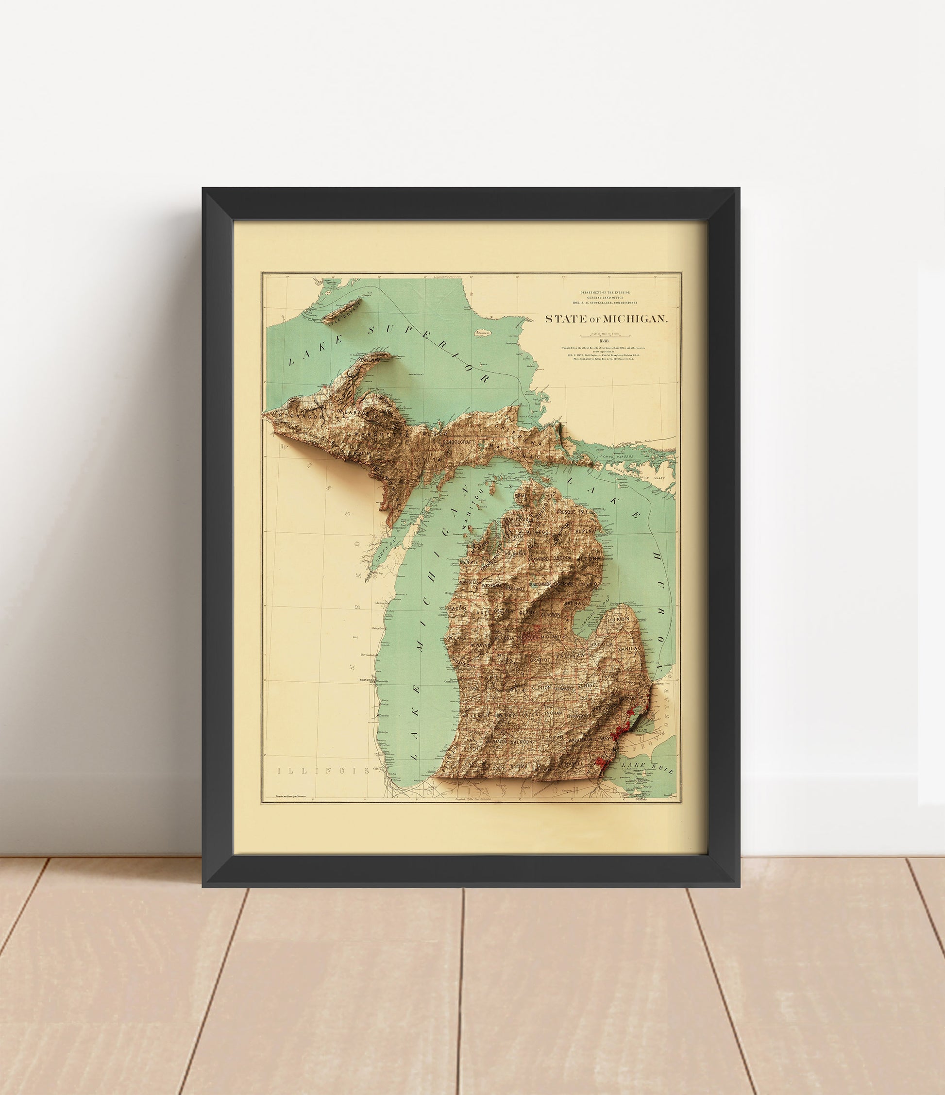 Vintage Michigan shaded relief map in black frame. Artistic print with realistic terrain effect for wall decor