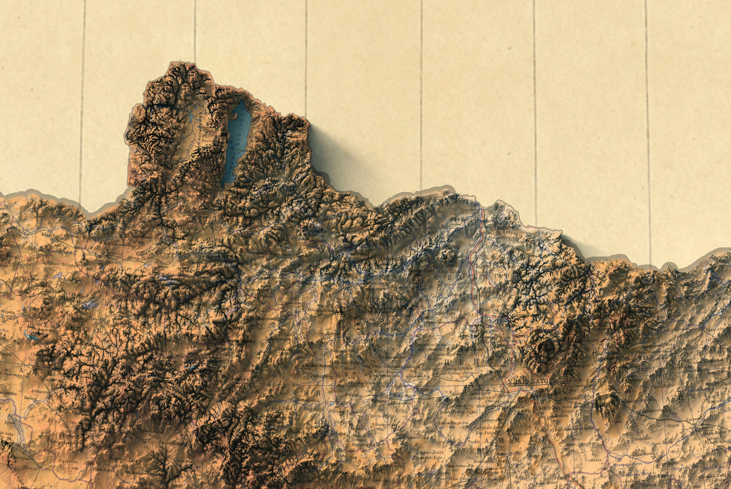 Detailed close-up of a vintage Mongolia relief map, showcasing textured topography and geographic contours