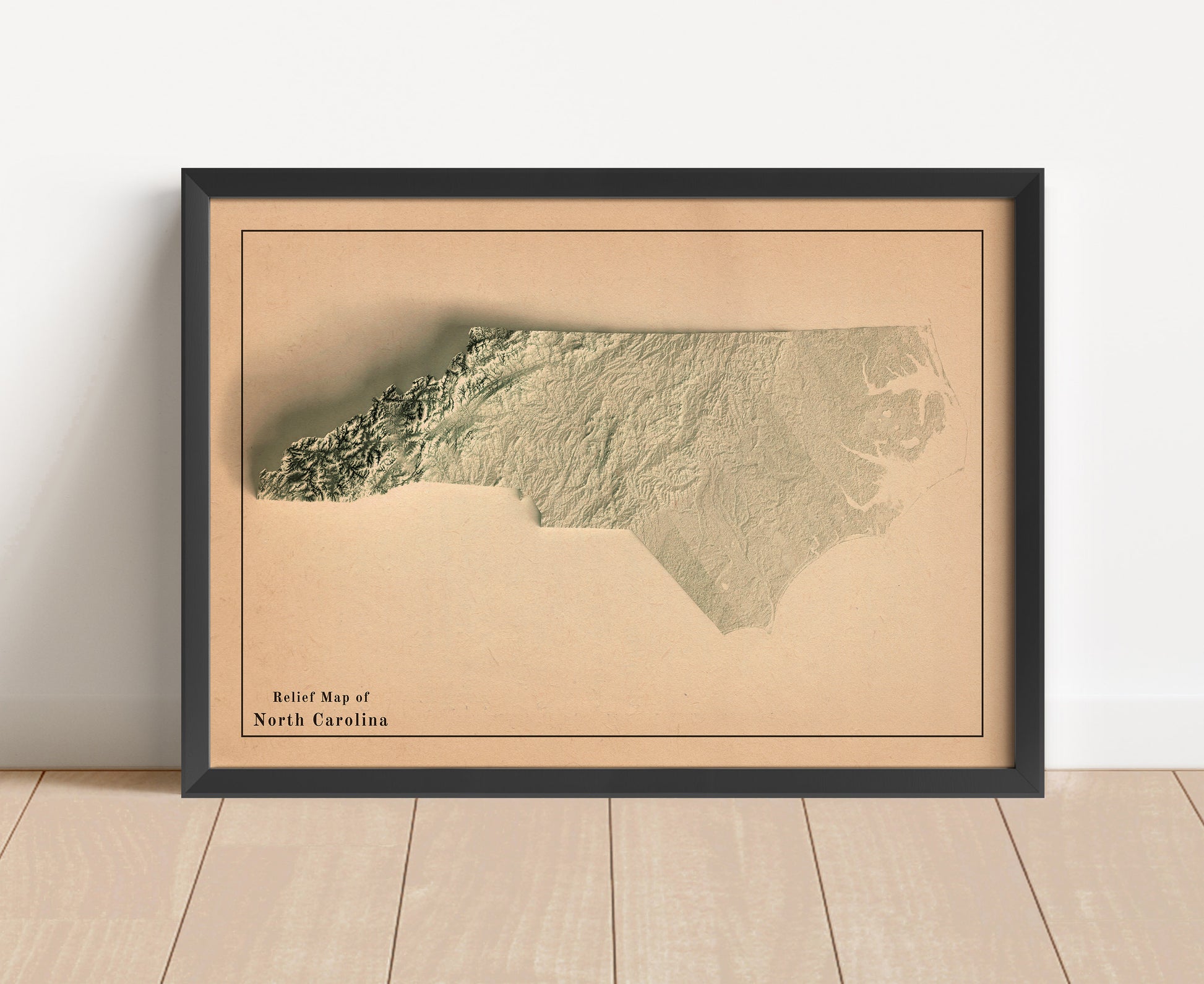 Vintage North Carolina shaded relief map in black frame. Artistic print with realistic terrain effect for wall decor