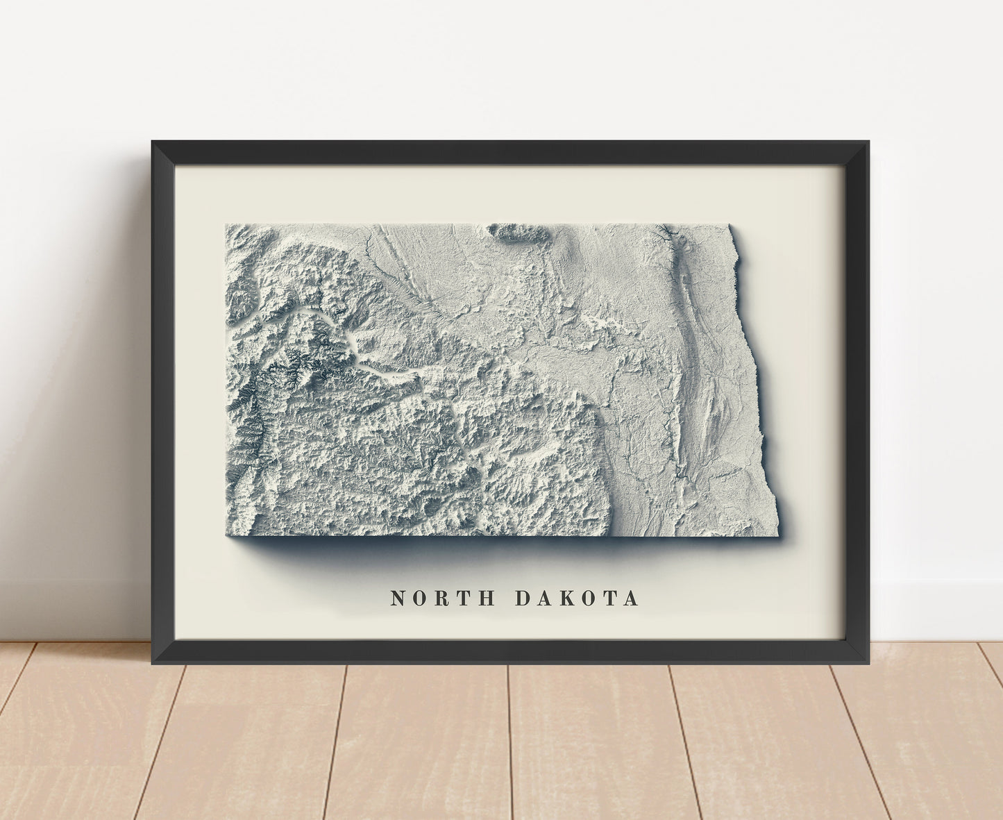 North Dakota shaded relief map in black frame. Artistic print with realistic terrain effect for wall decor
