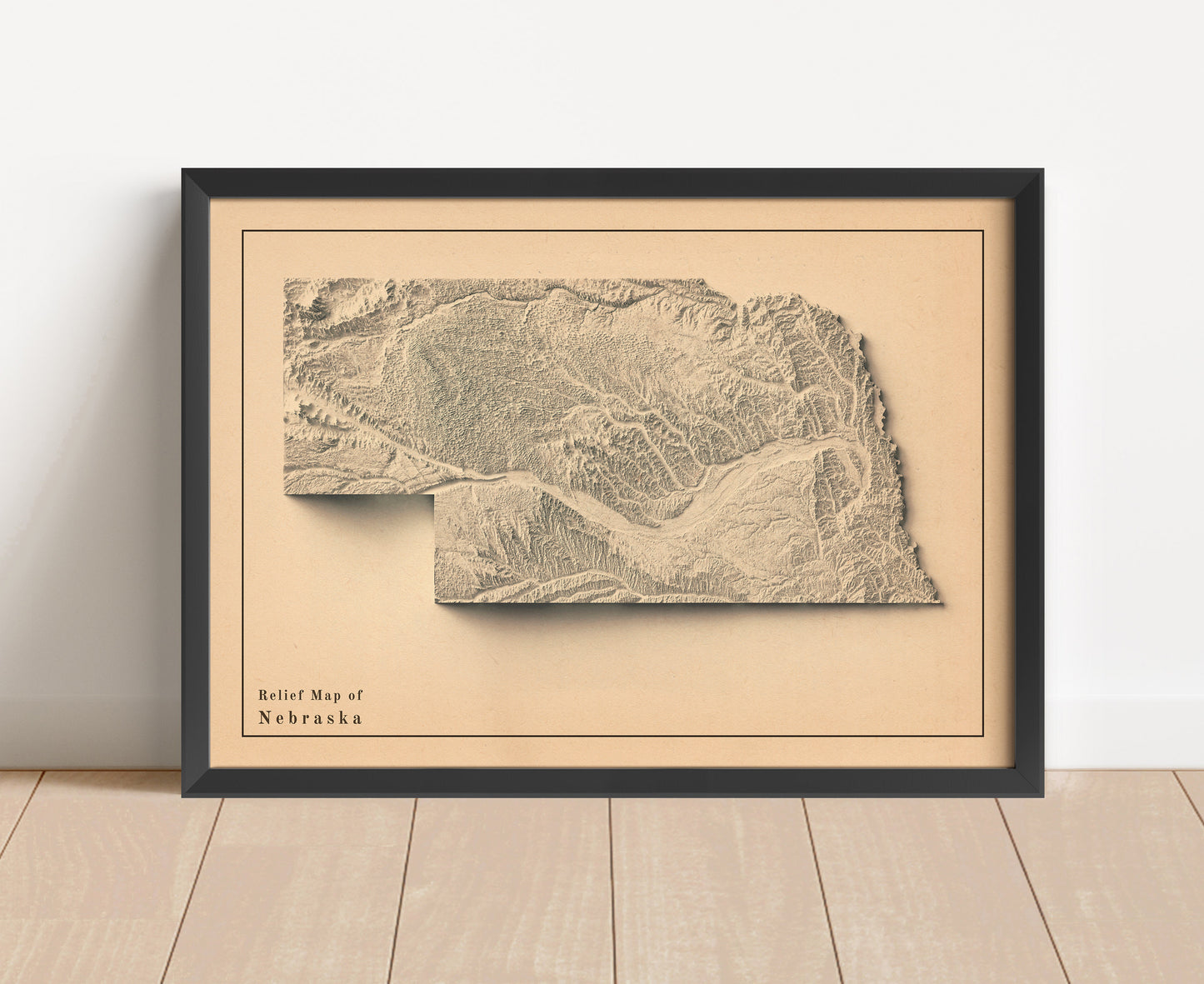 Vintage Nebraska shaded relief map in black frame. Artistic print with realistic terrain effect for wall decor