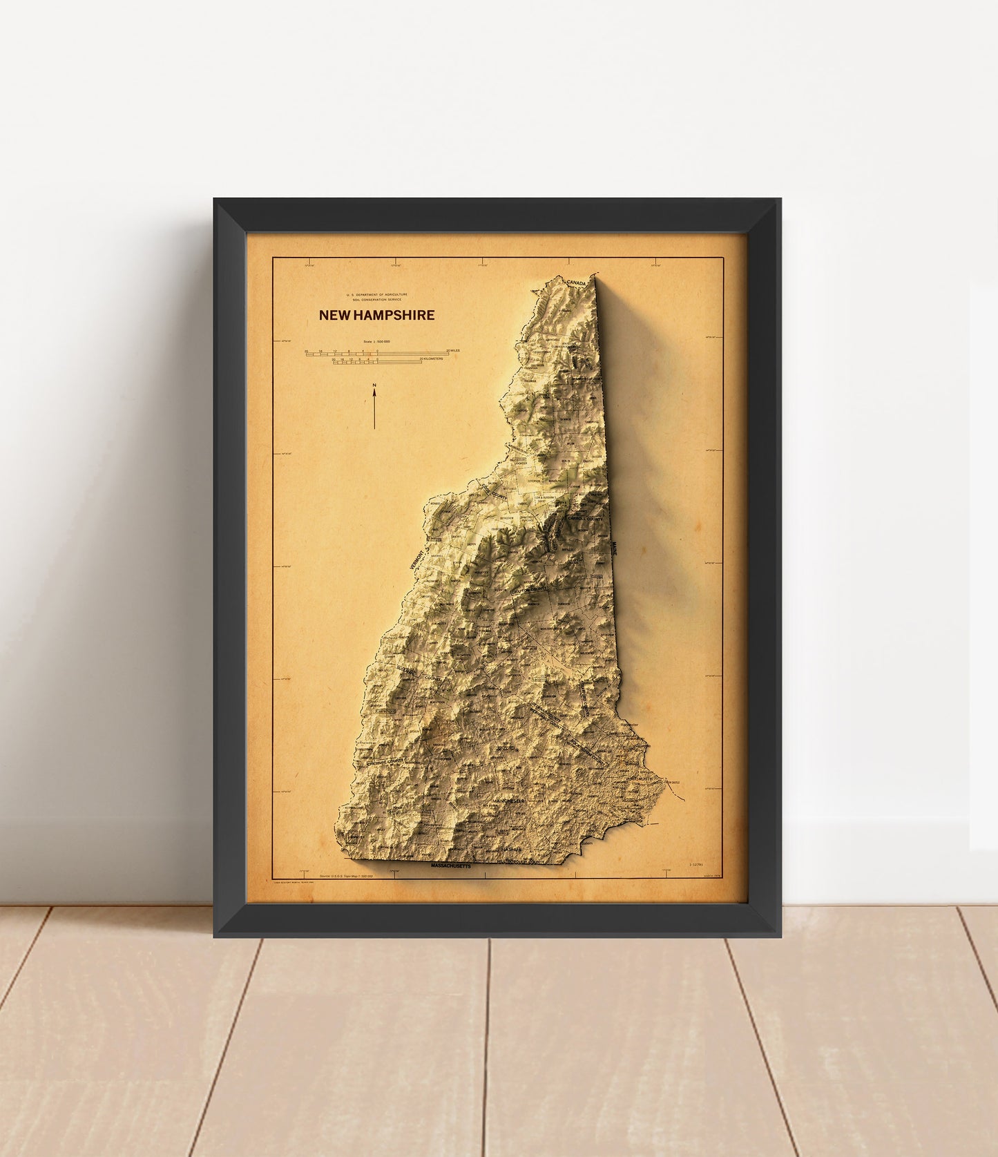 Vintage New Hampshire shaded relief map in black frame. Artistic print with realistic terrain effect for wall decor
