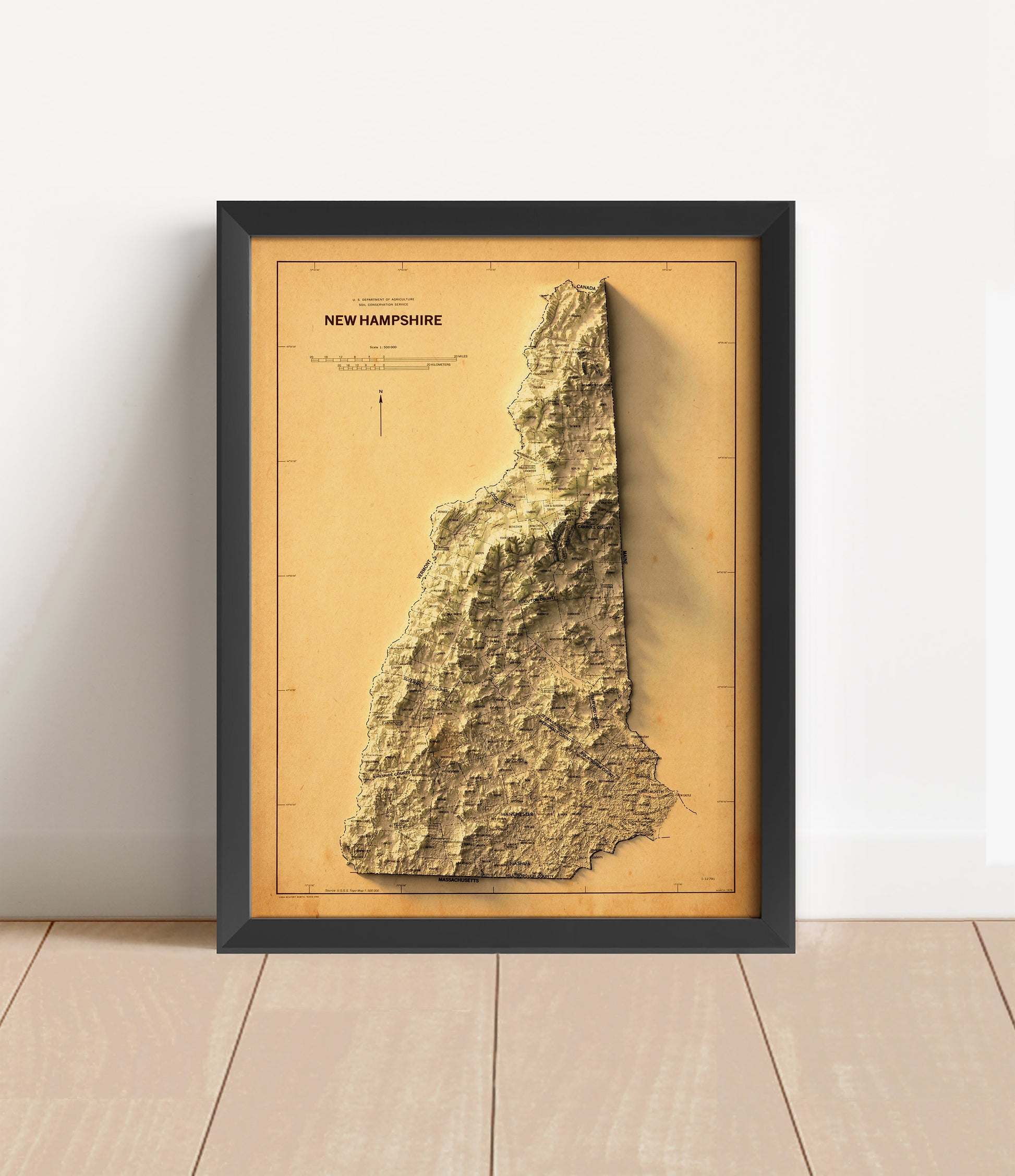 Vintage New Hampshire shaded relief map in black frame. Artistic print with realistic terrain effect for wall decor
