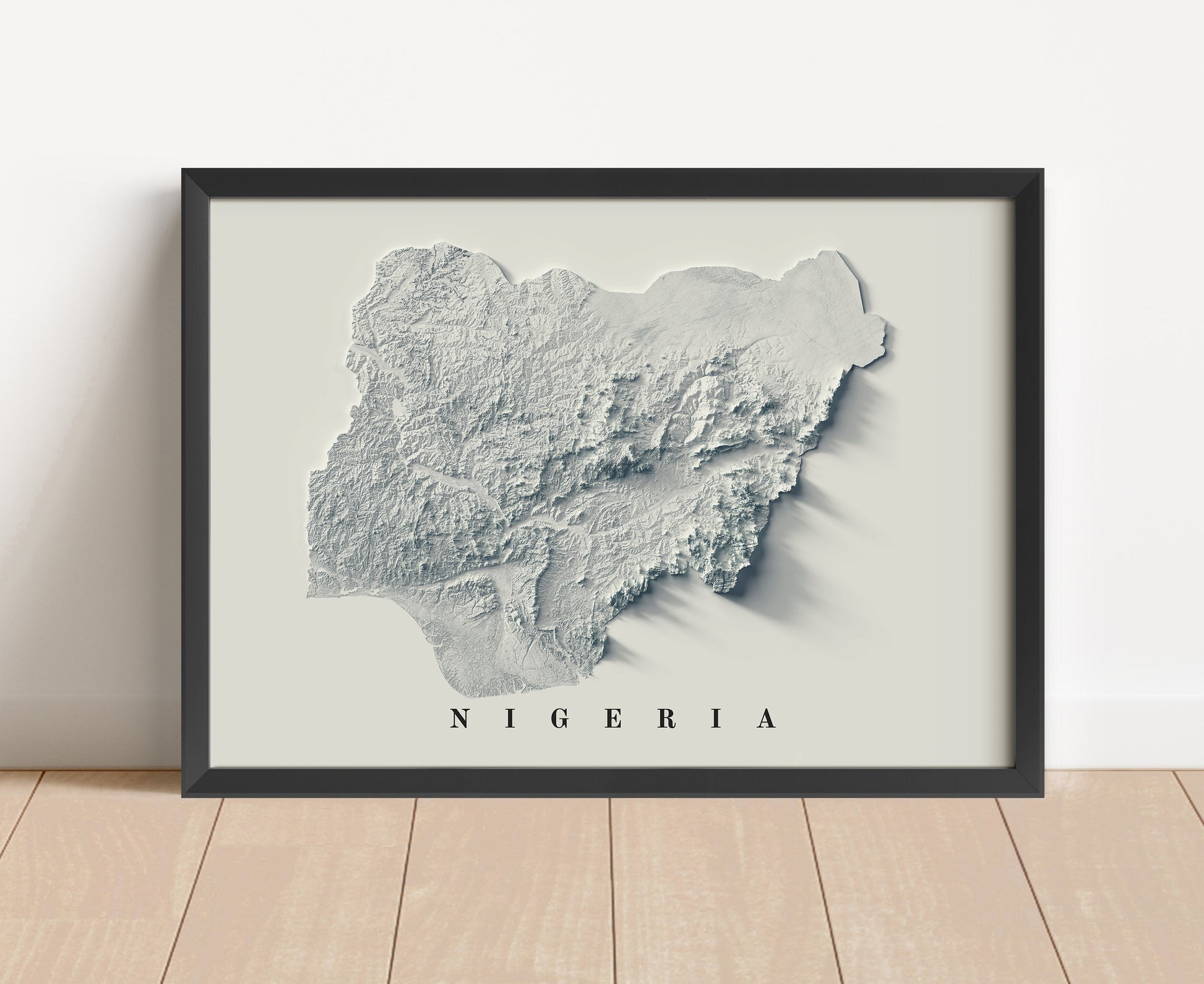 Nigeria shaded relief map in black frame. Artistic print with realistic terrain effect for wall decor