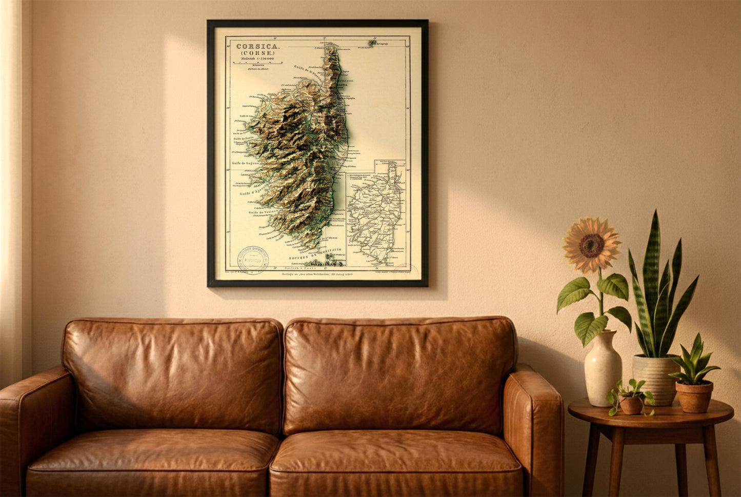 Corsica Corse vintage relief map in a black frame above a brown leather sofa. Boho living room with warm sunlight, sunflower, and indoor plants on a wooden side table