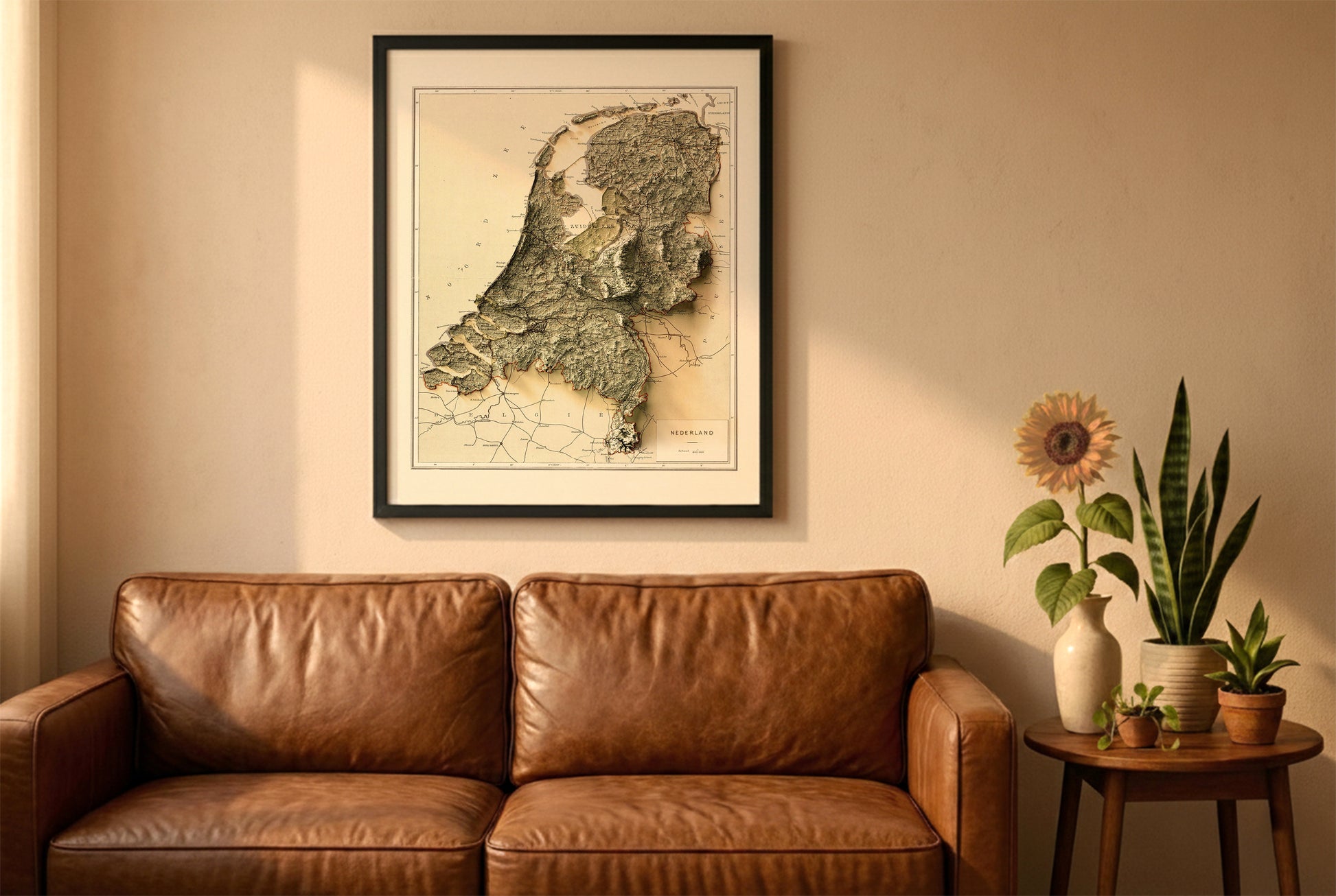 Netherlands vintage relief map in a black frame above a brown leather sofa. Boho living room with warm sunlight, sunflower, and indoor plants on a wooden side table