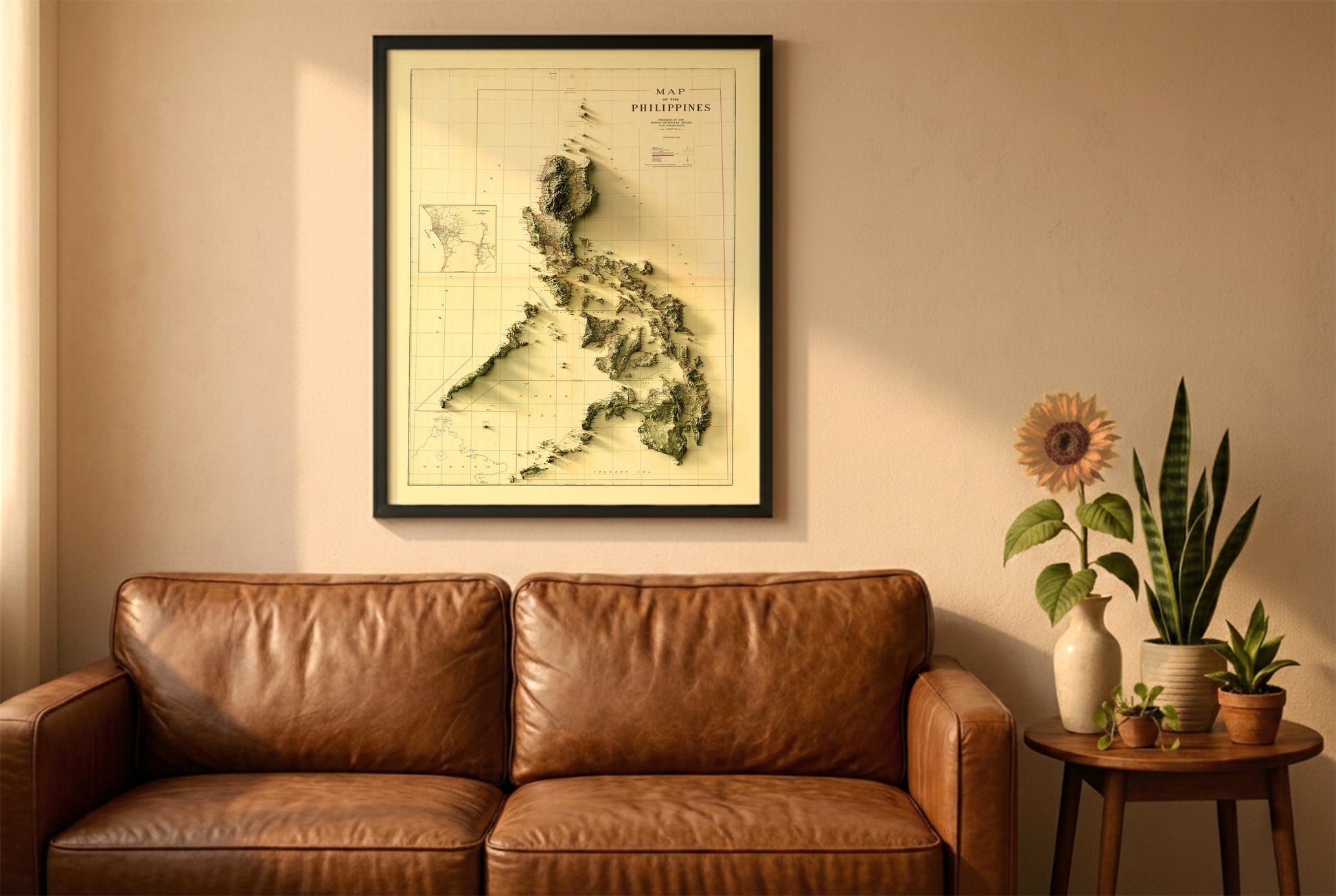 Philippines vintage relief map in a black frame above a brown leather sofa. Boho living room with warm sunlight, sunflower, and indoor plants on a wooden side table