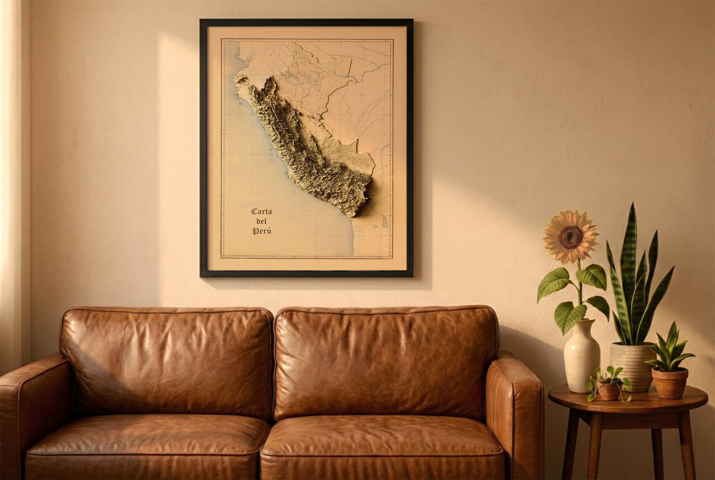 Peru vintage relief map in a black frame above a brown leather sofa. Boho living room with warm sunlight, sunflower, and indoor plants on a wooden side table