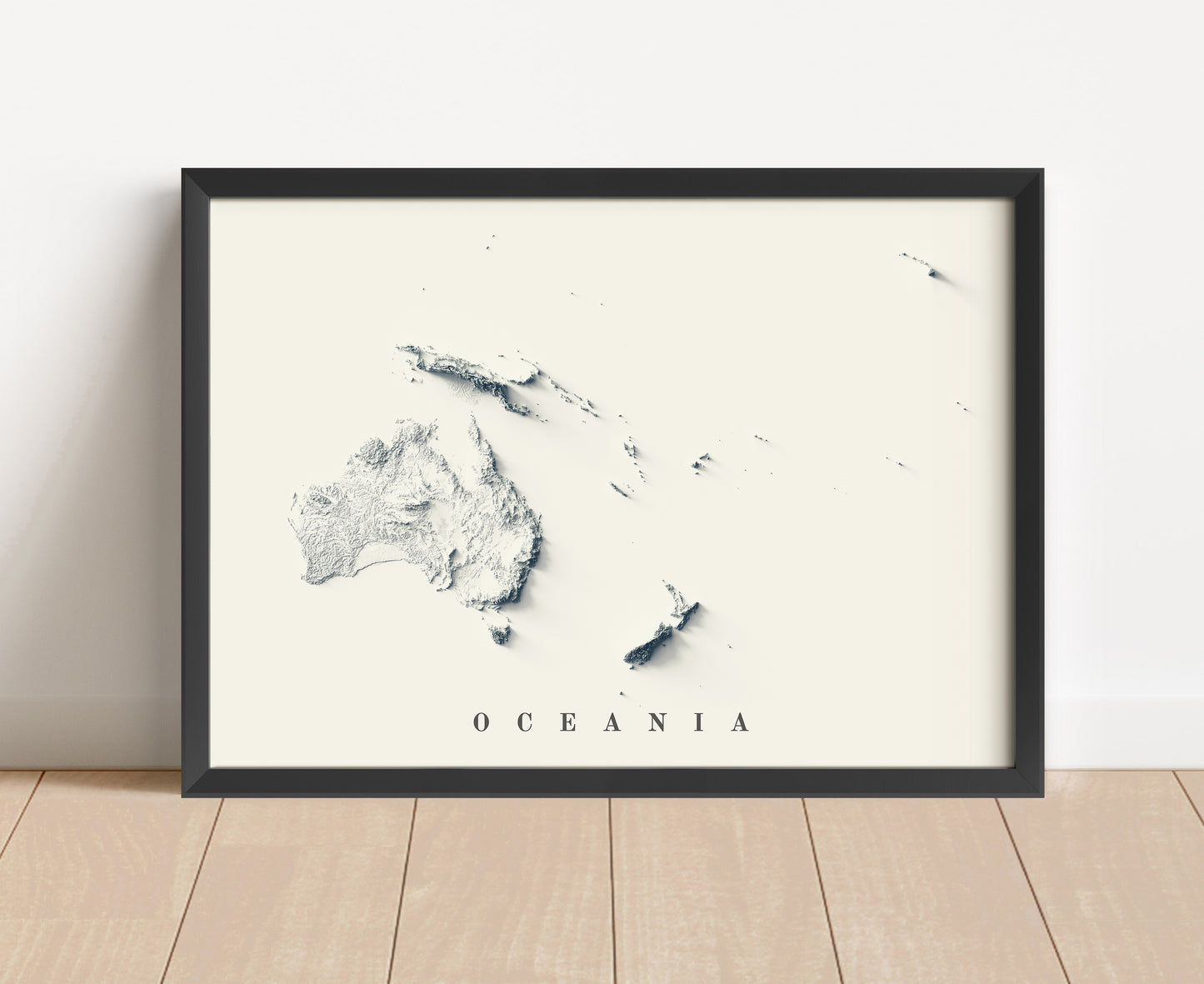 Oceania shaded relief map in black frame. Artistic print with realistic terrain effect for wall decor