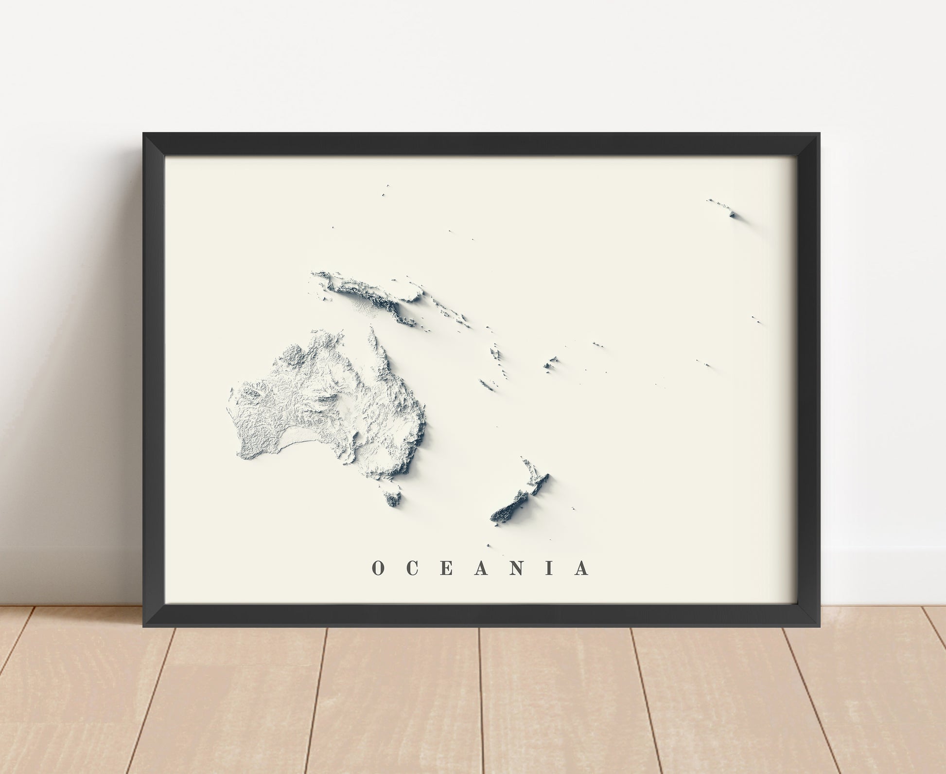 Oceania shaded relief map in black frame. Artistic print with realistic terrain effect for wall decor