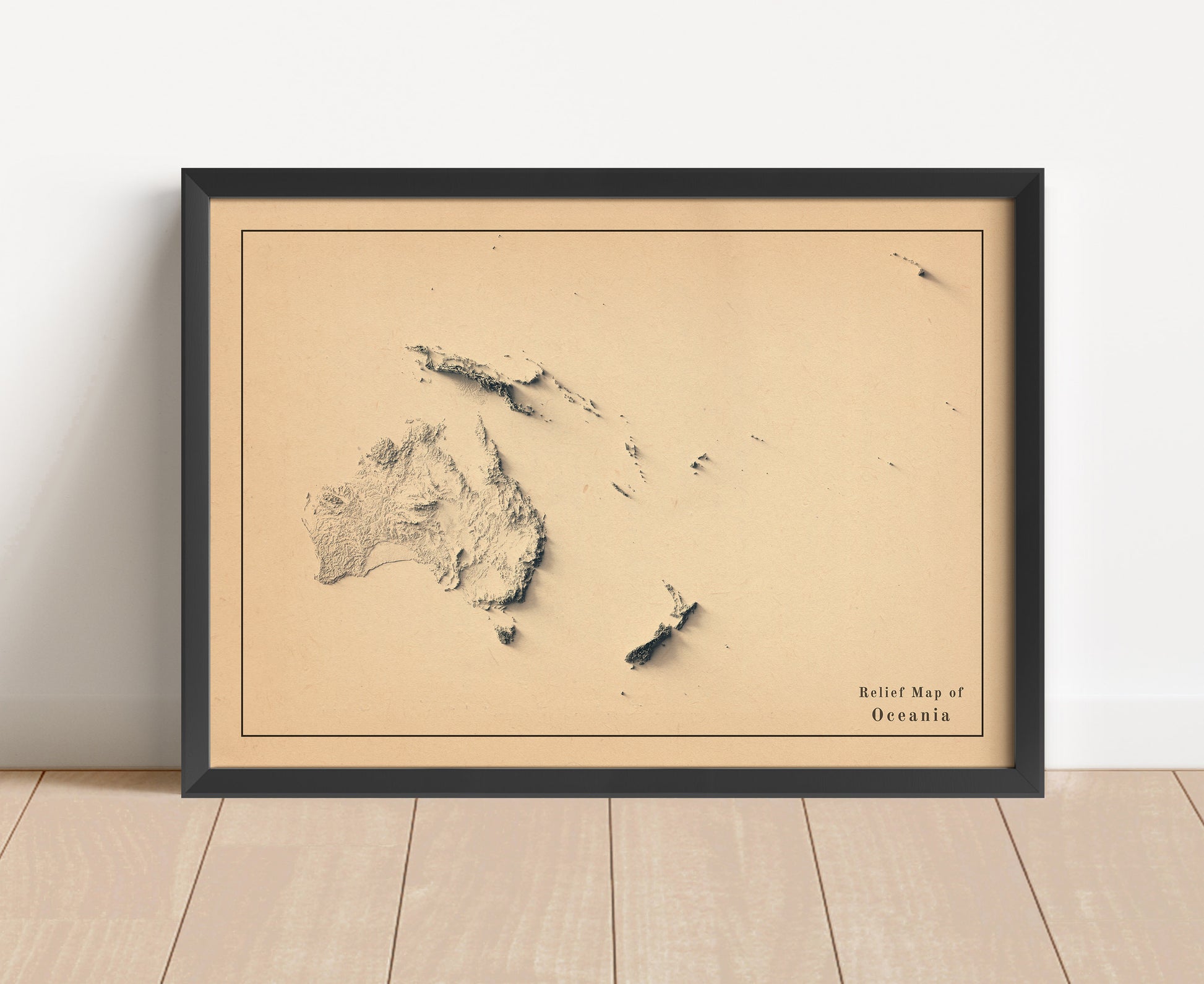 Vintage Oceania shaded relief map in black frame. Artistic print with realistic terrain effect for wall decor