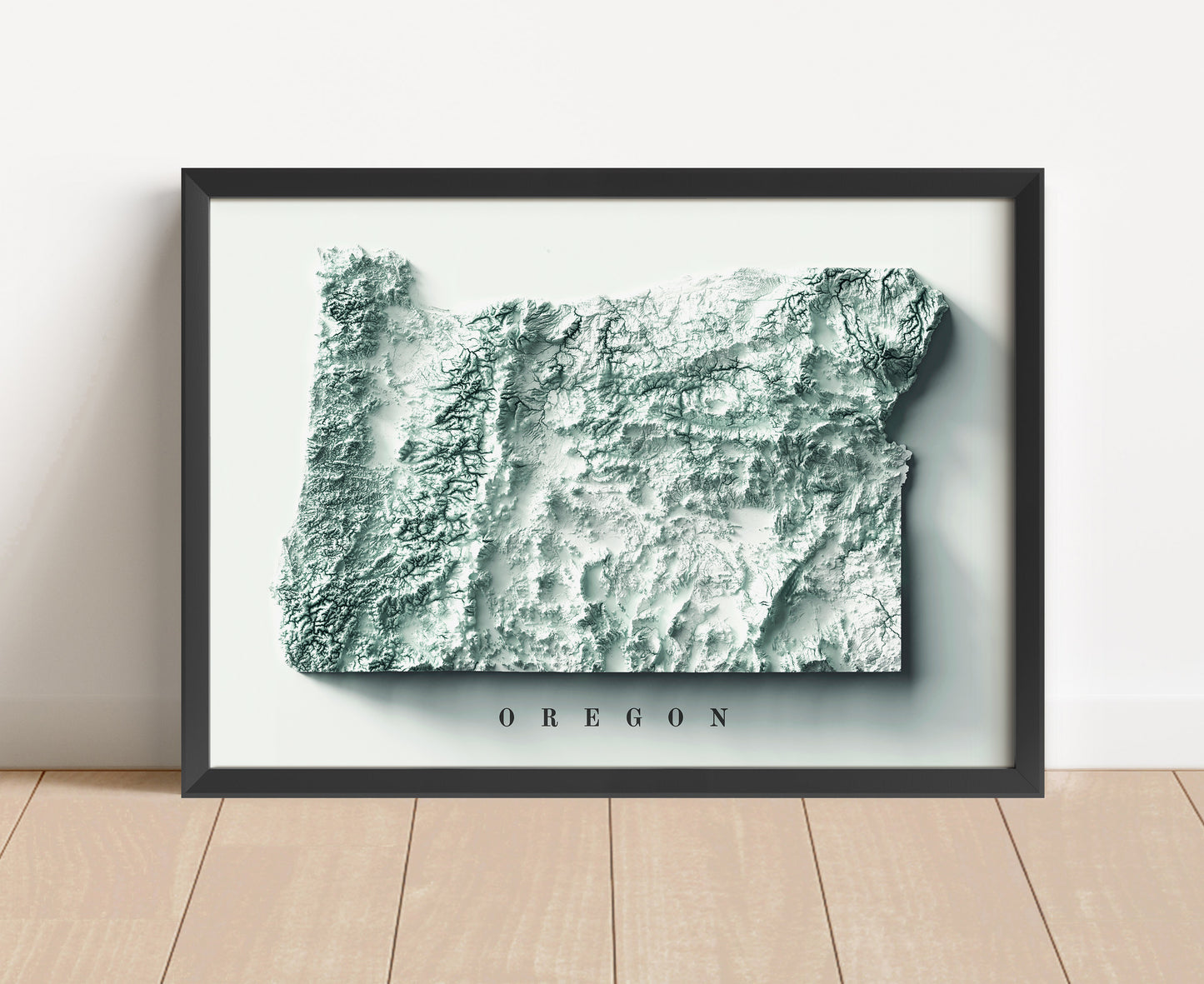 Oregon shaded relief map in black frame. Artistic print with realistic terrain effect for wall decor