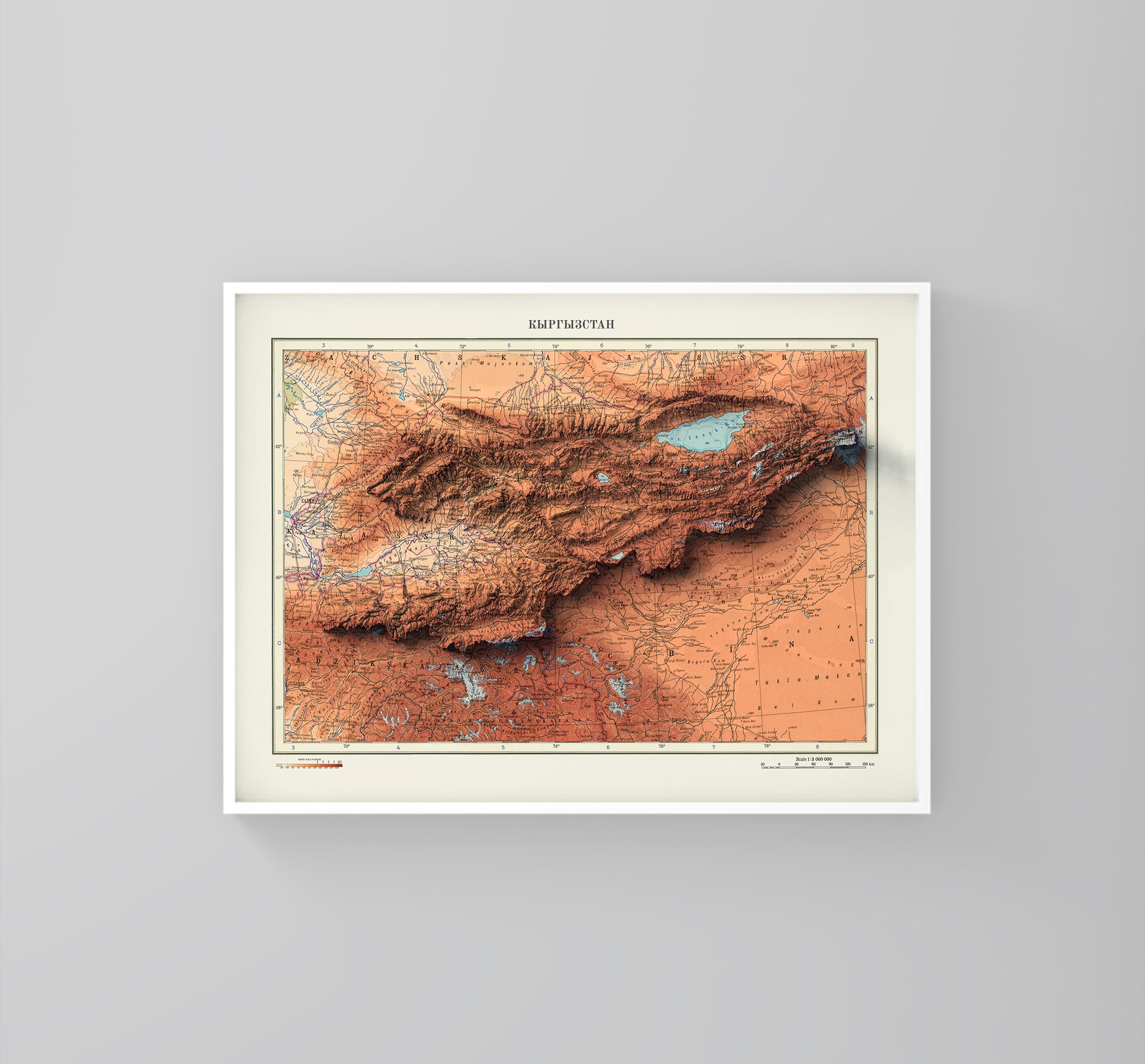 Kyrgyzstan vintage framed shaded relief map in white frame. Artistic print highlighting mountains with a realistic 3d effect