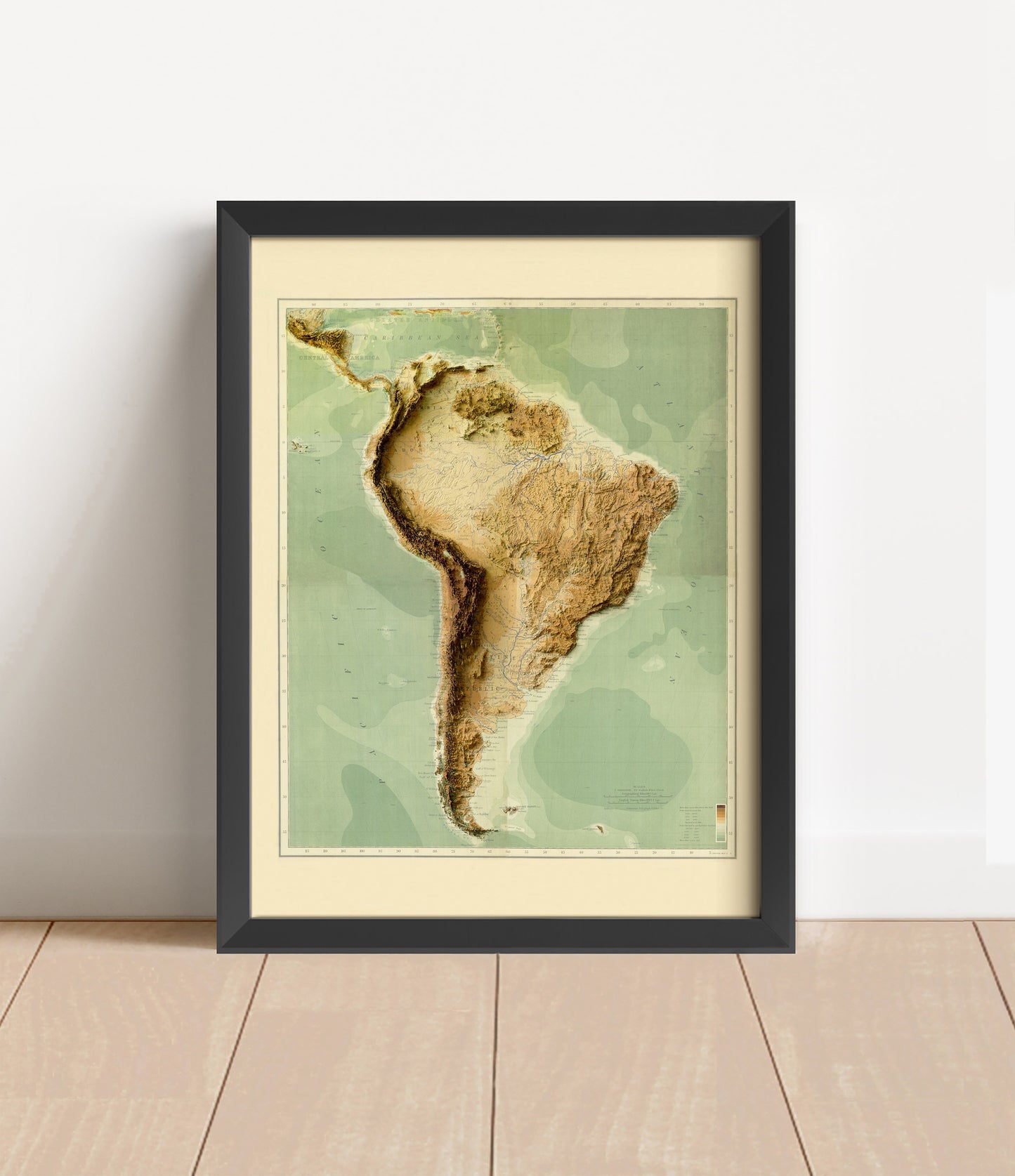 Vintage South America shaded relief map in black frame. Artistic print with realistic terrain effect for wall decor