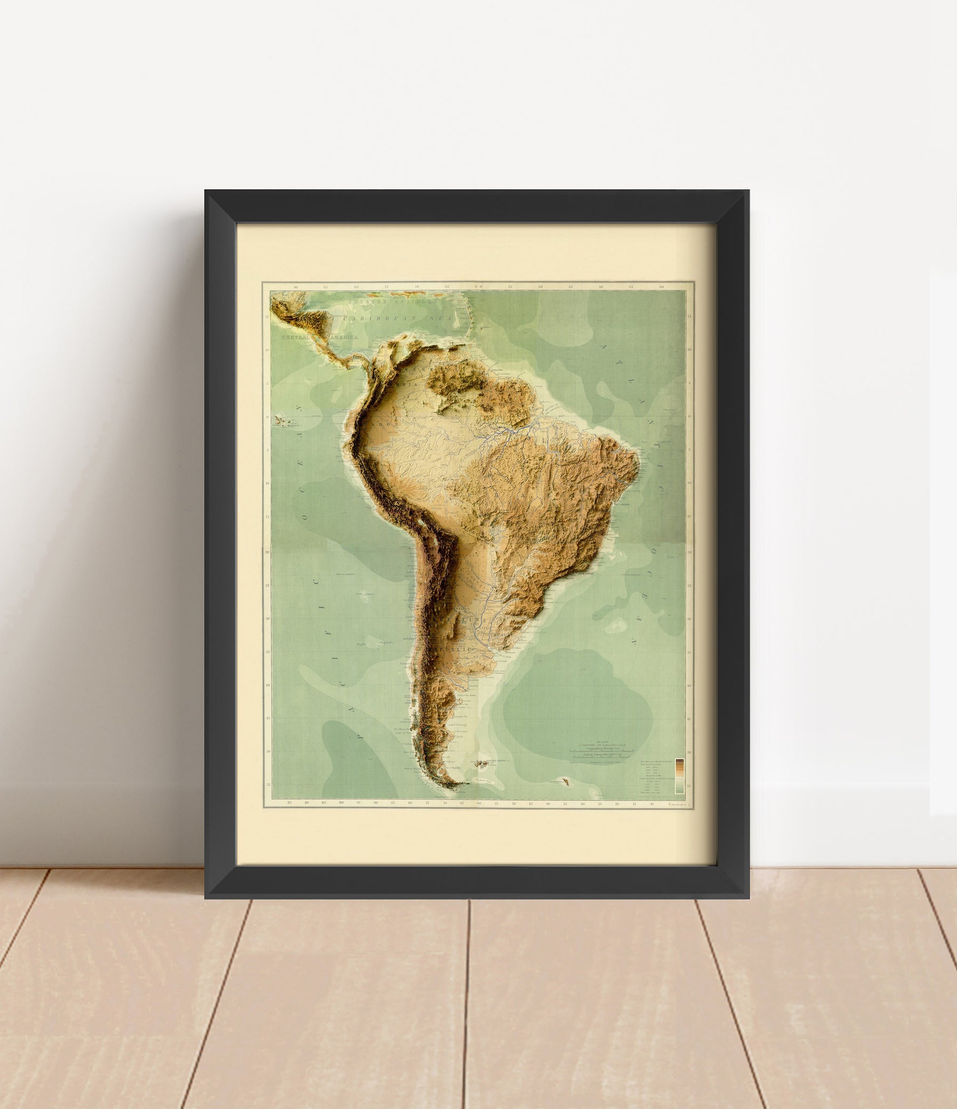 Vintage South America shaded relief map in black frame. Artistic print with realistic terrain effect for wall decor