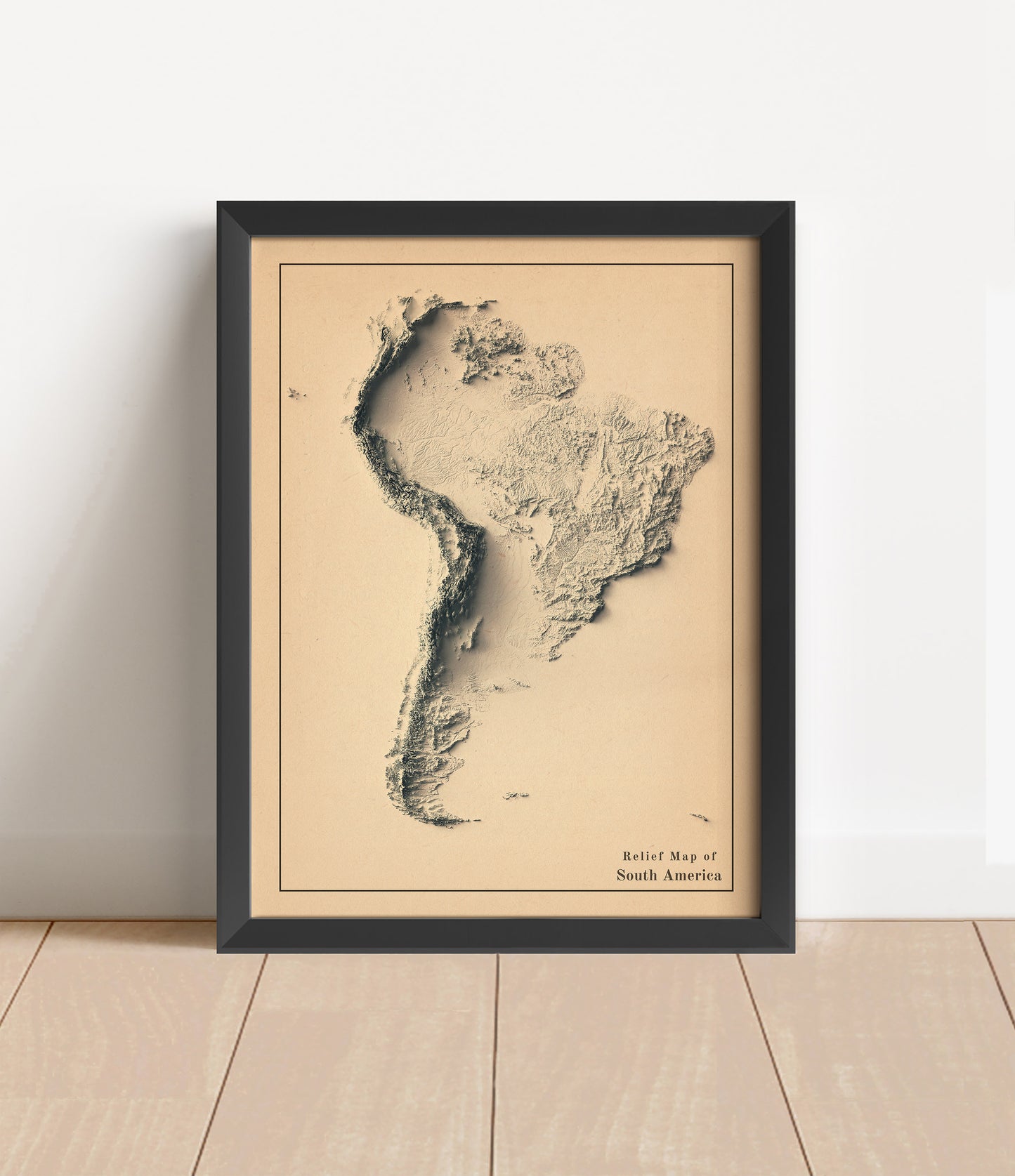 Vintage South America shaded relief map in black frame. Artistic print with realistic terrain effect for wall decor
