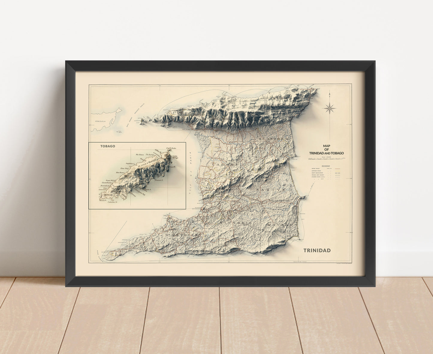 Vintage Trinidad and Tobago shaded relief map in black frame. Artistic print with realistic terrain effect for wall decor.
