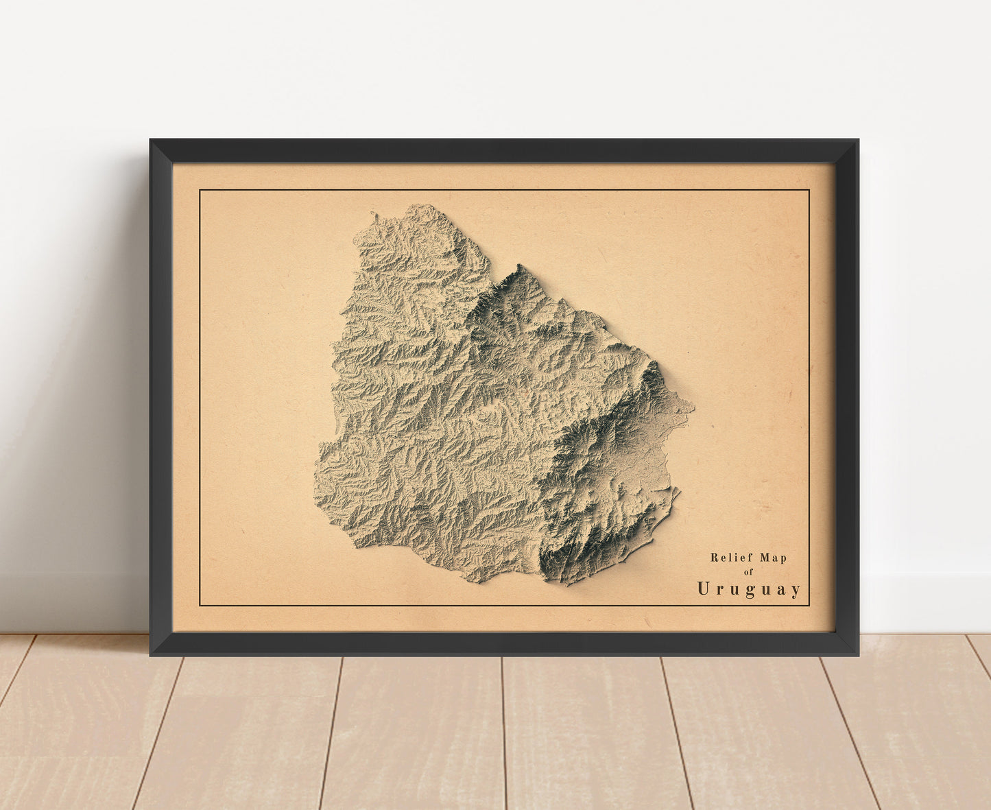 Vintage Uruguay shaded relief map in black frame. Artistic print with realistic terrain effect for wall decor