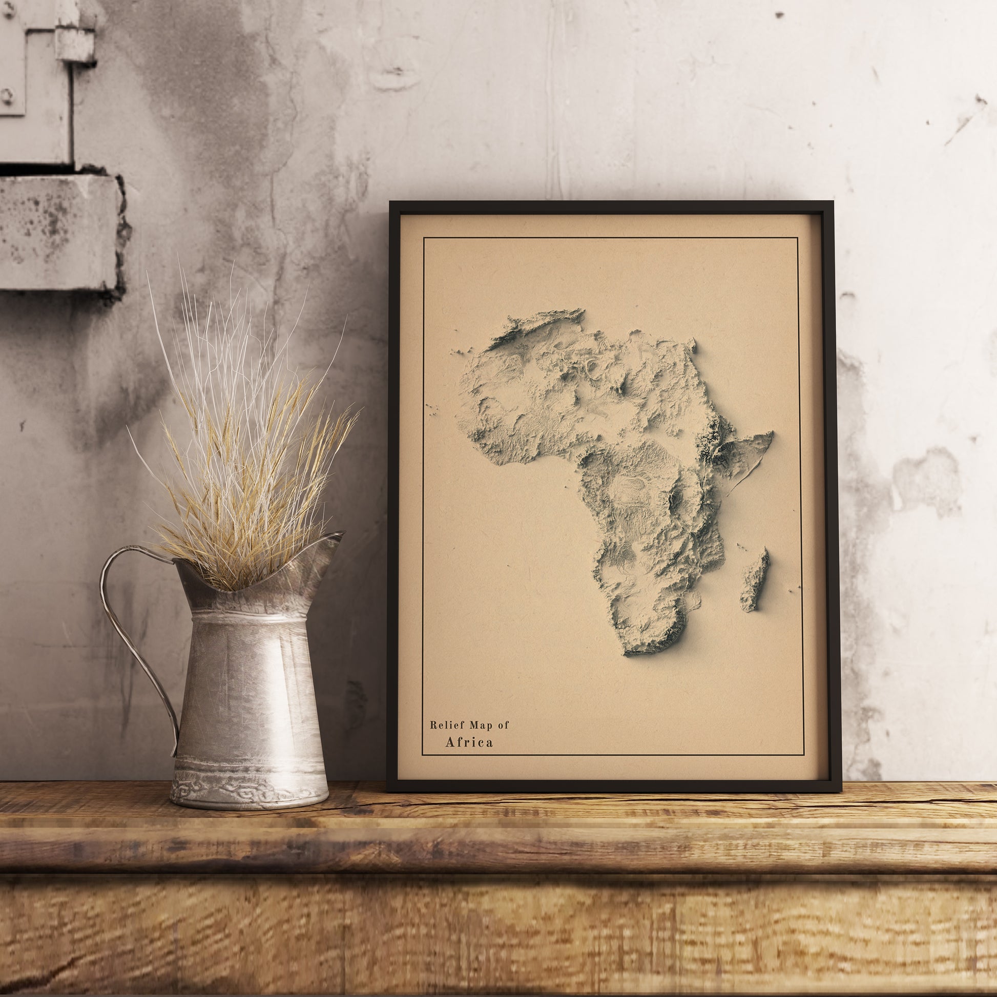 Africa shaded relief map in black frame. Realistic terrain art print for home decor, displayed on rustic wooden table