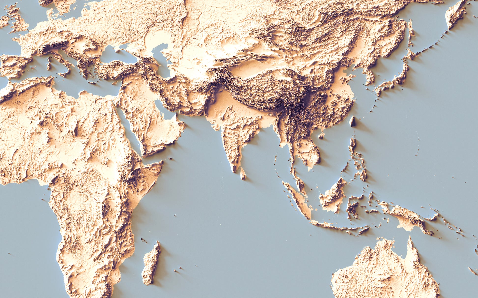 Detailed close-up of a World relief map with sunset tones, showcasing textured topography and geographic contours