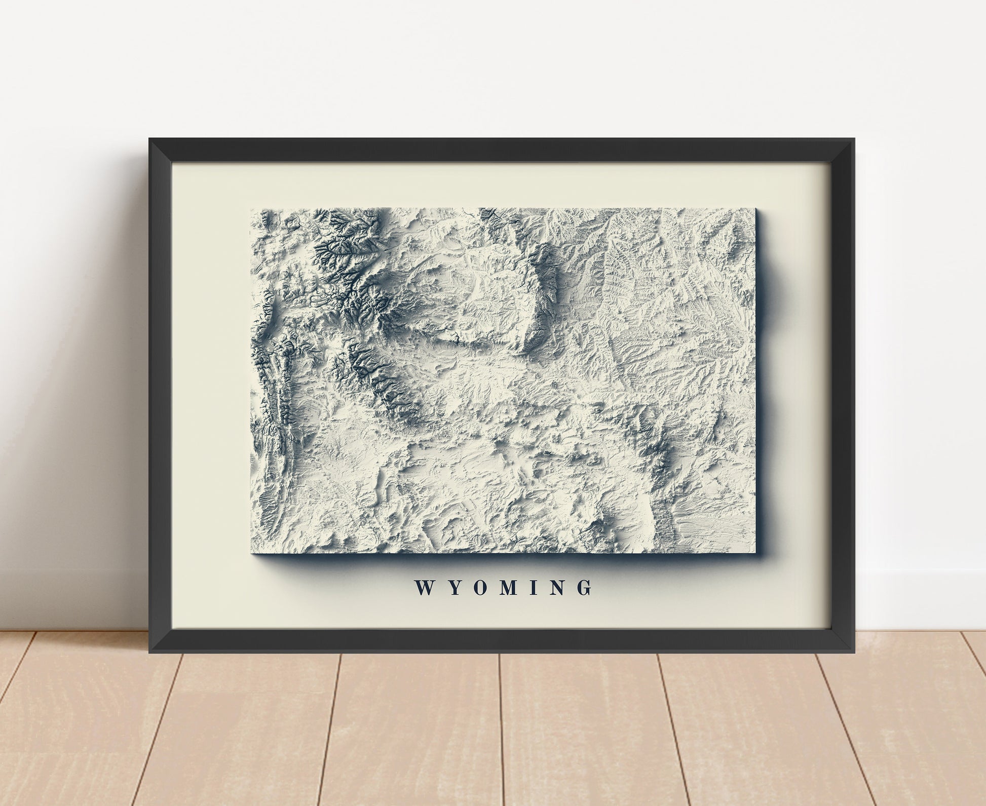 Wyoming shaded relief map in black frame. Artistic print with realistic terrain effect for wall decor