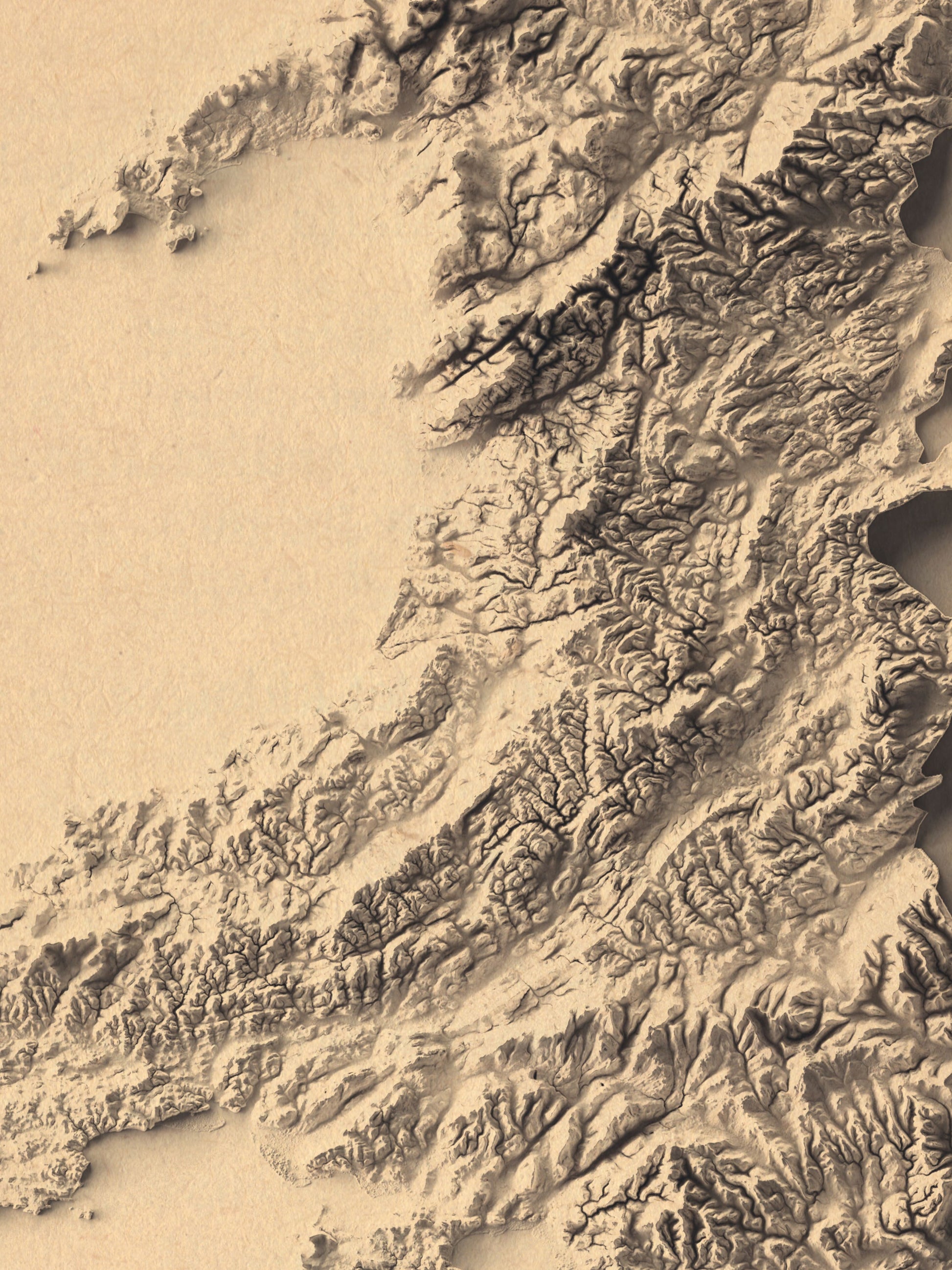 Detailed close-up of a wales relief map, showcasing textured topography and geographic contours